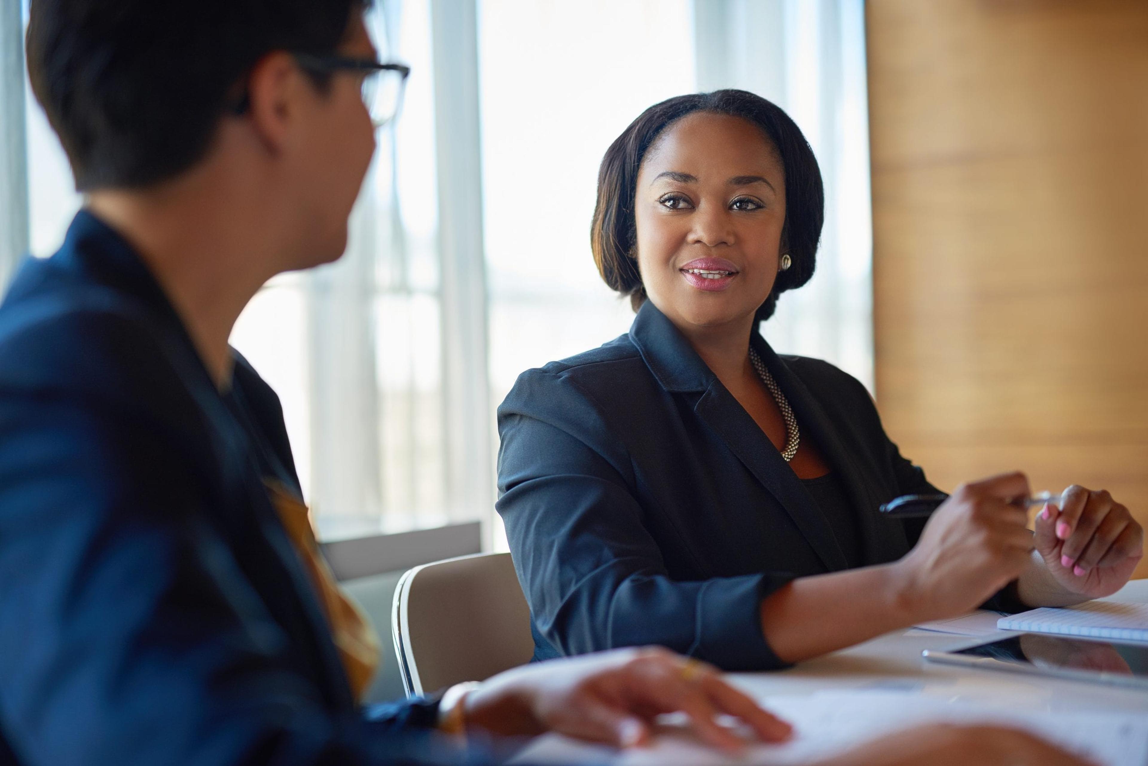 Woman talking to co-worker