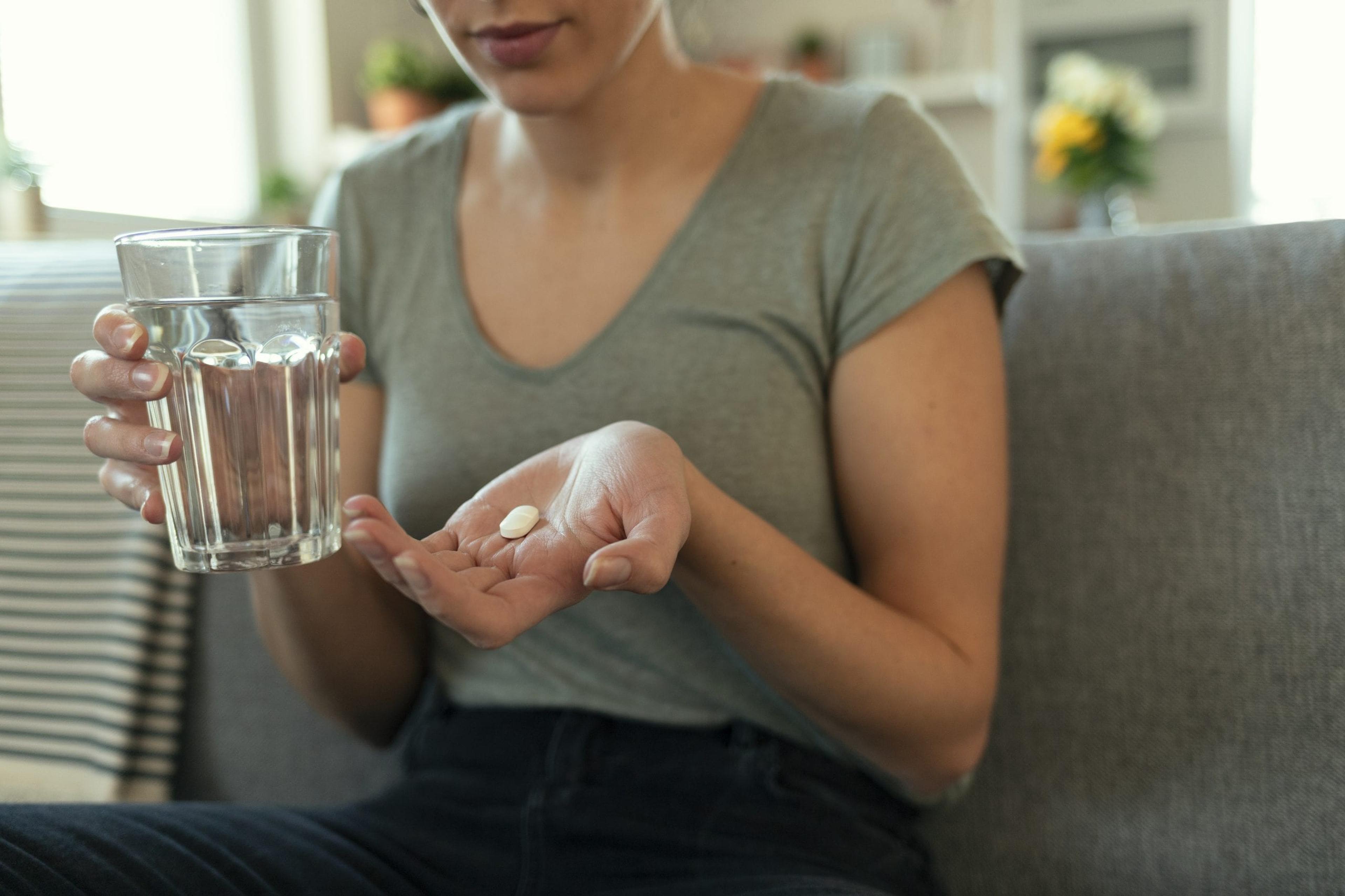 Woman taking a pill