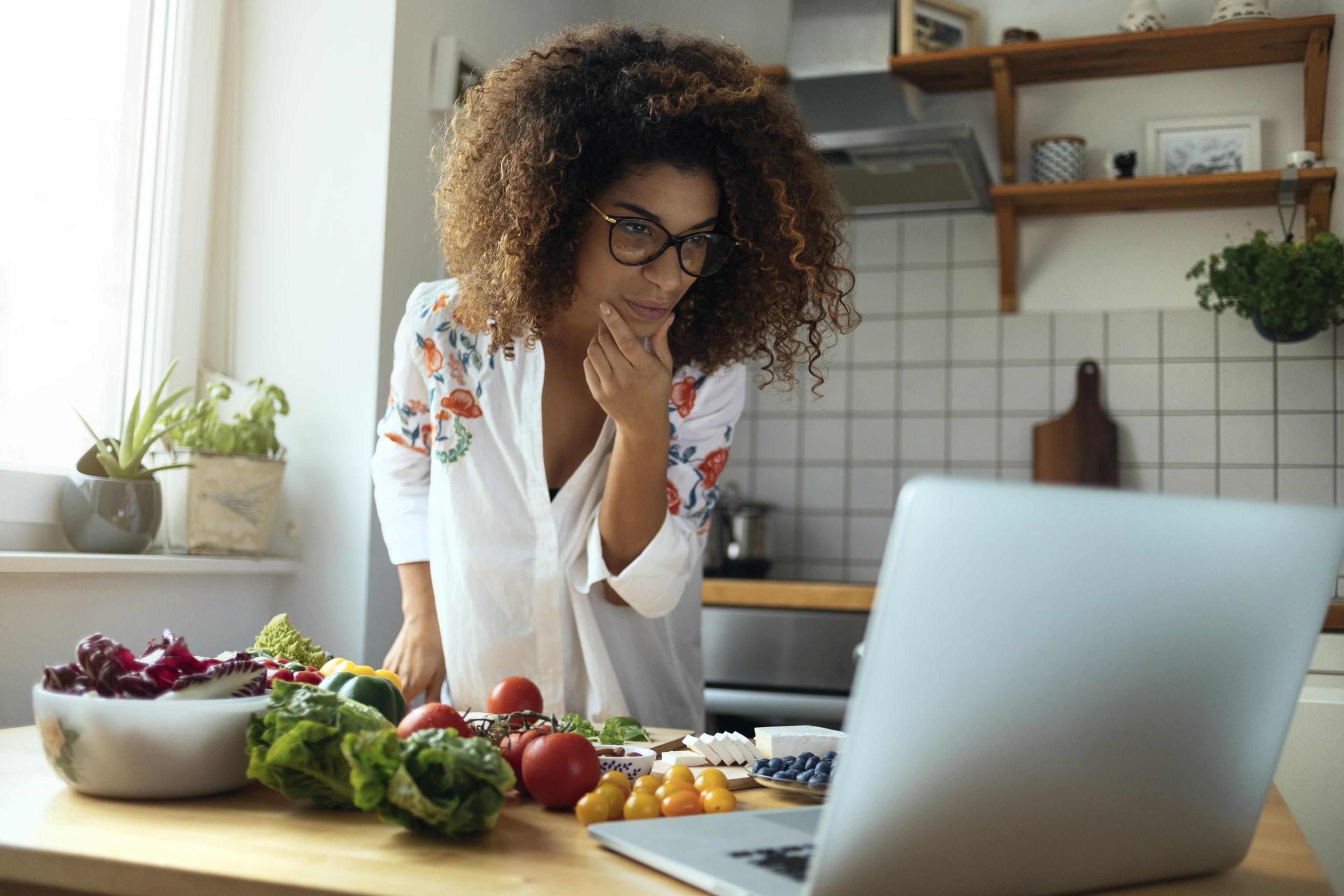 Young woman exploring the web for healthy recipes