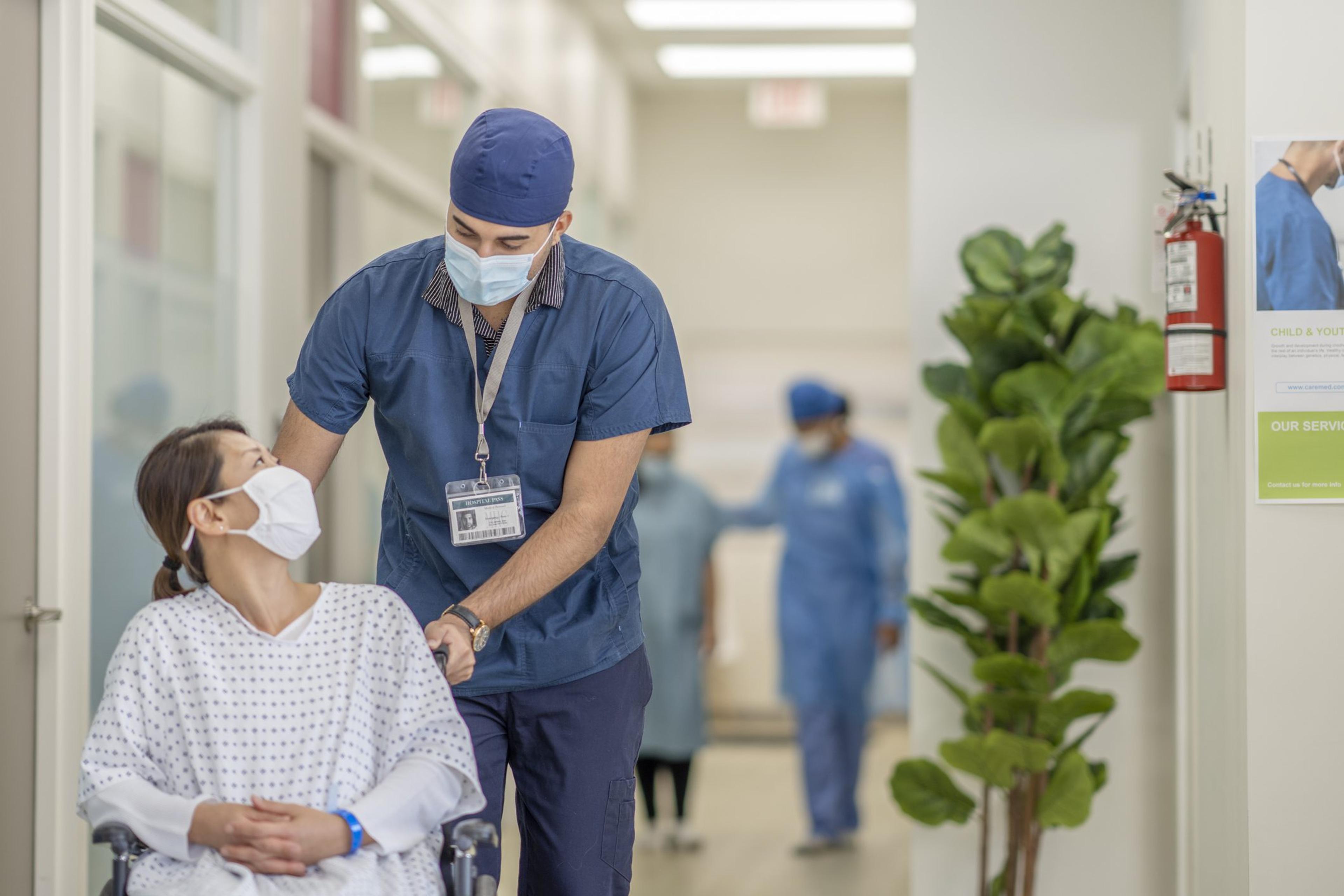 Masked male nurse and patient