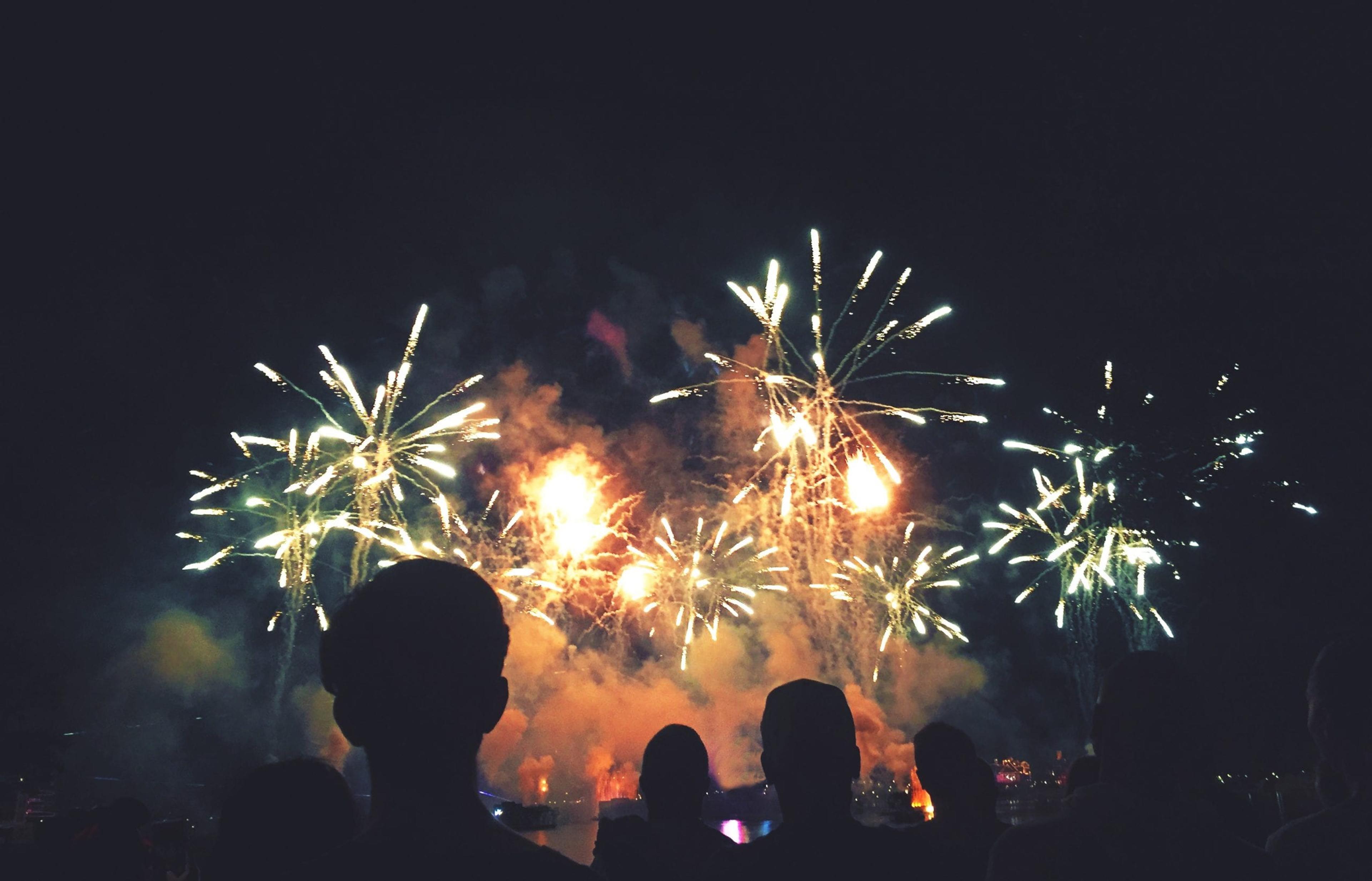 People watch a fireworks display