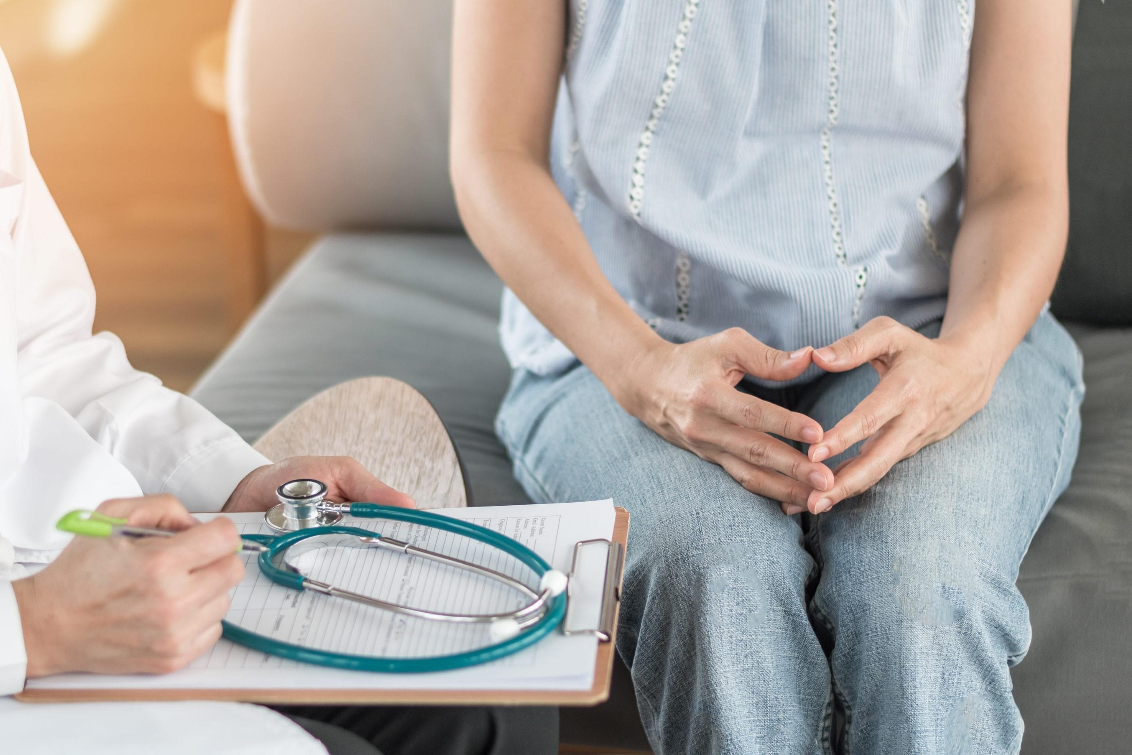 Woman discussing diagnosis with her doctor