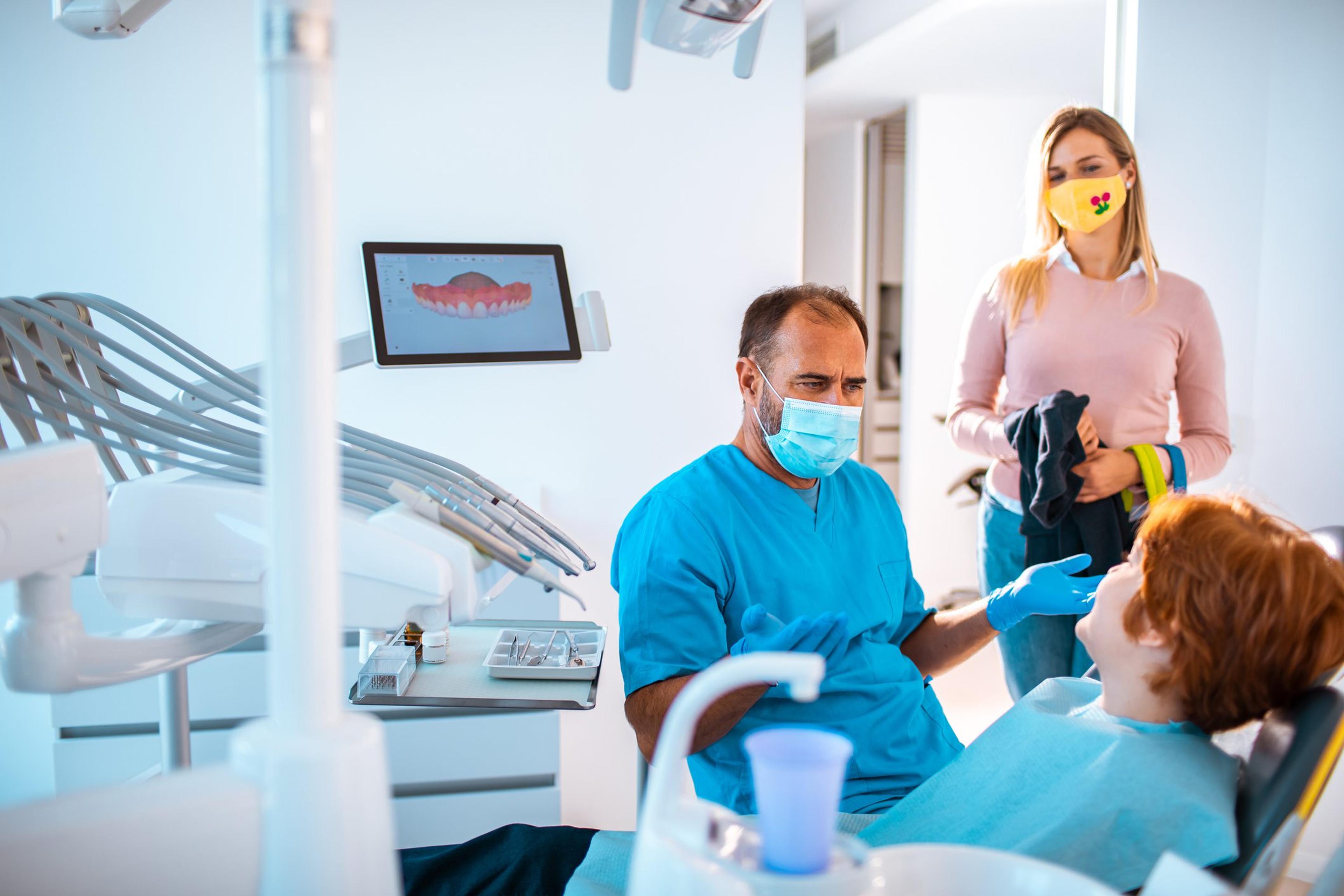 Mother taking her son to the Dentist