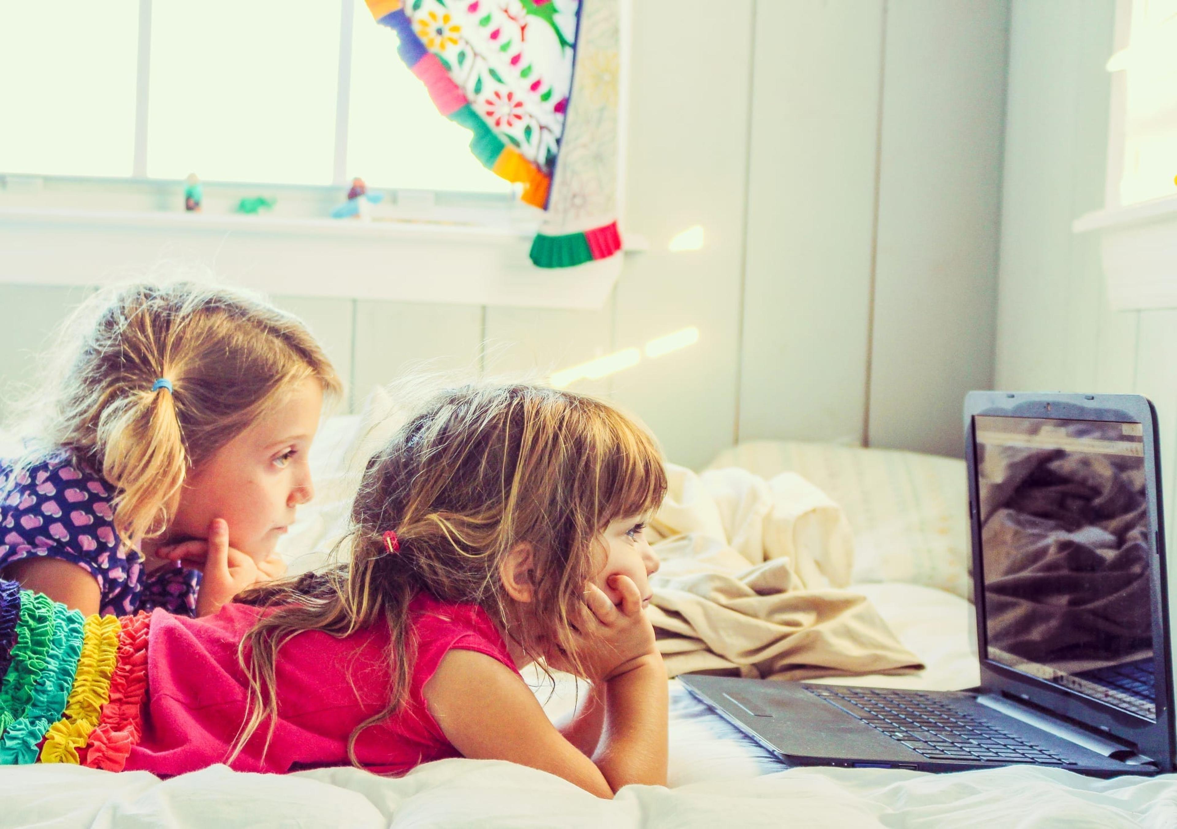 Two girls watching something on a laptop