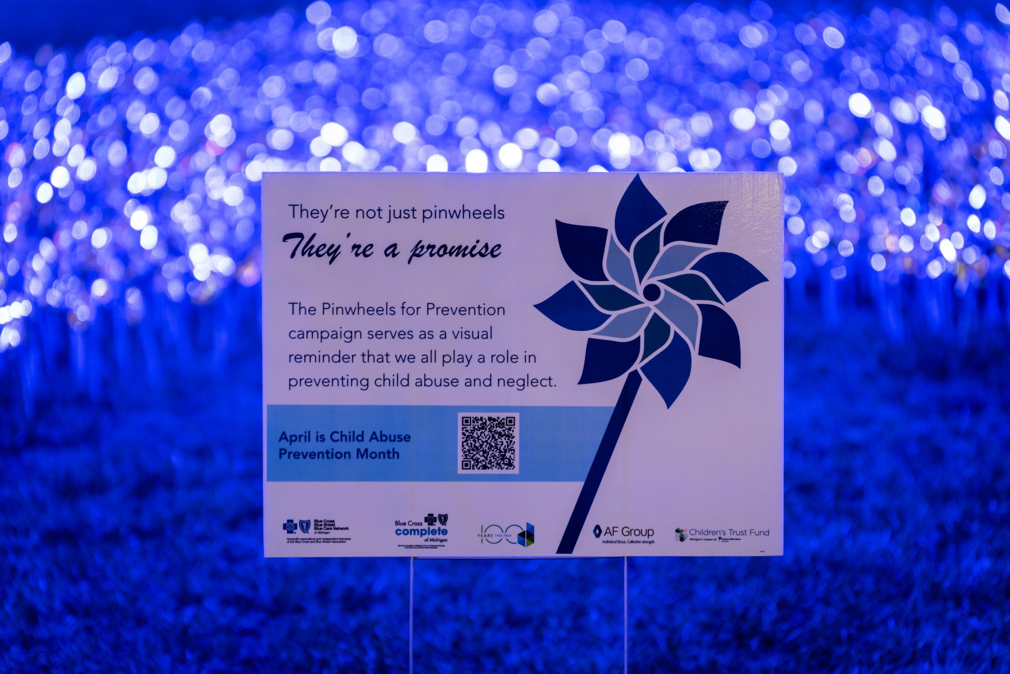 Graphic of a blue pinwheel for child abuse prevention month