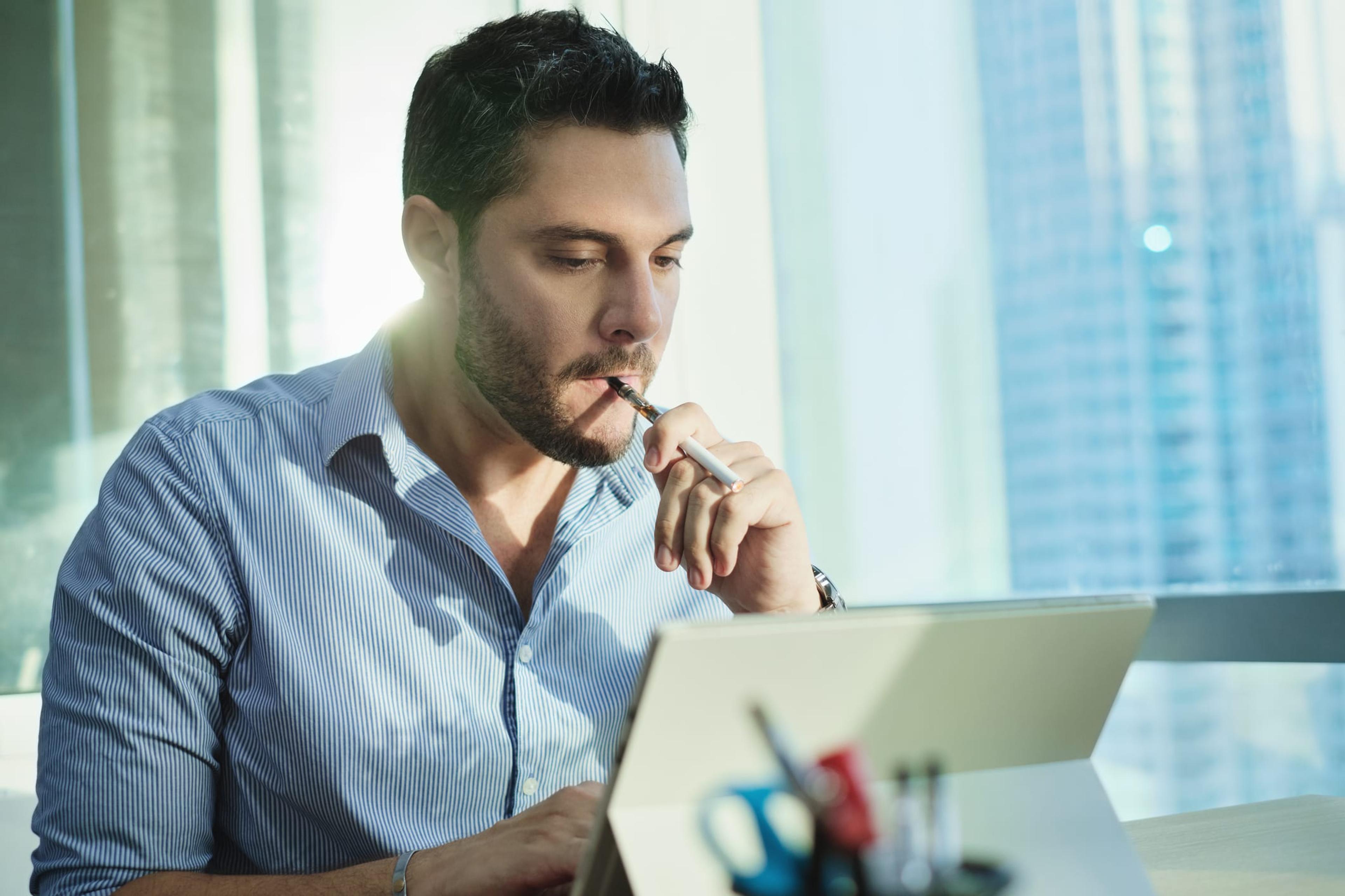 Man using e-cigarette