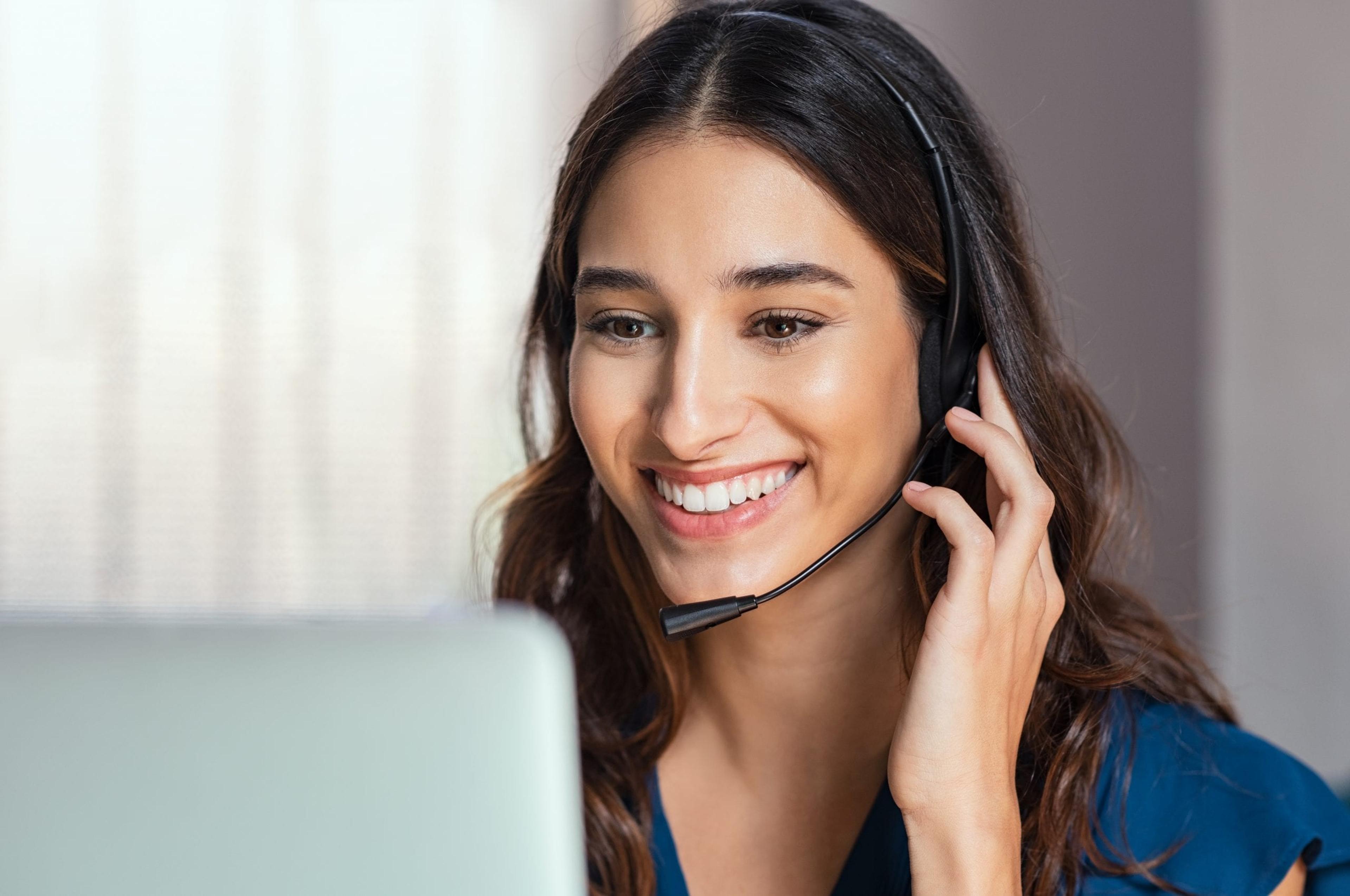 Smiling customer service rep on a headset