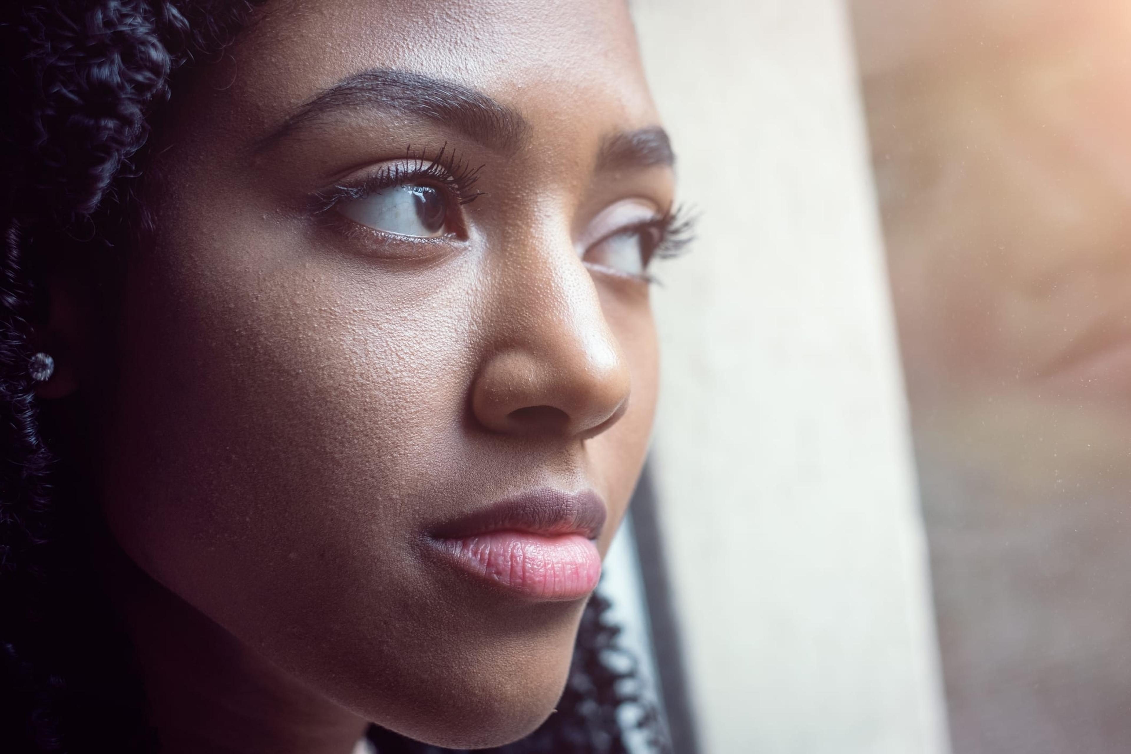 Woman looking out a window