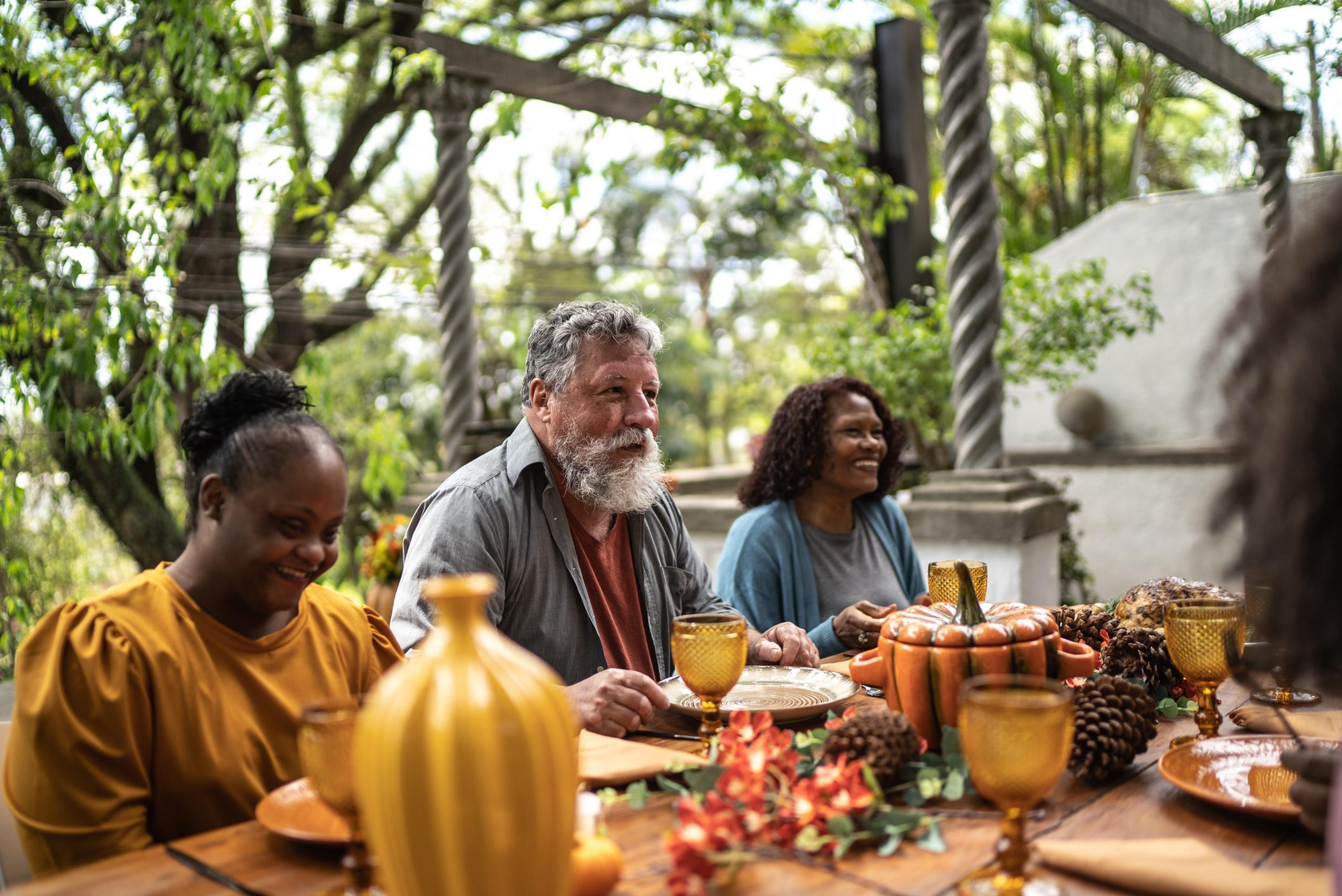 Family reunited on the table for Thanksgiving at home - including a special needs young woman