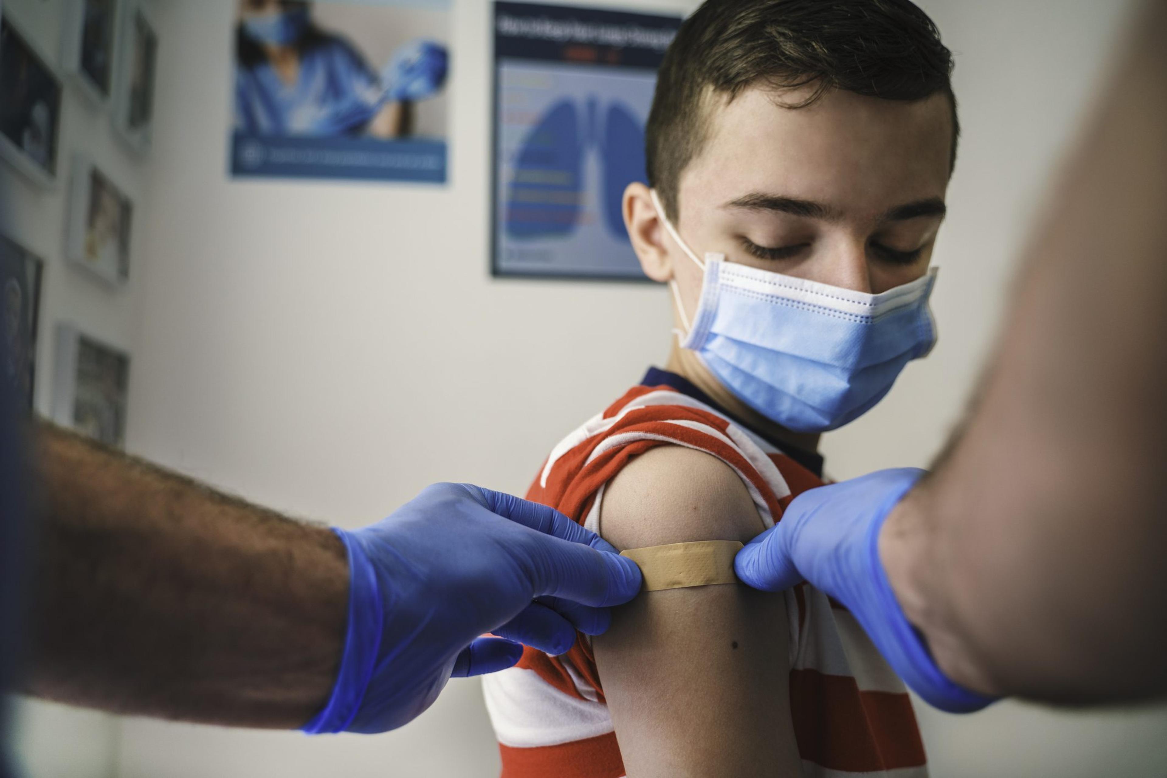 Patient Getting Vaccinated against COVID-19. Child, teenage boy vaccination. Coronavirus epidemic.