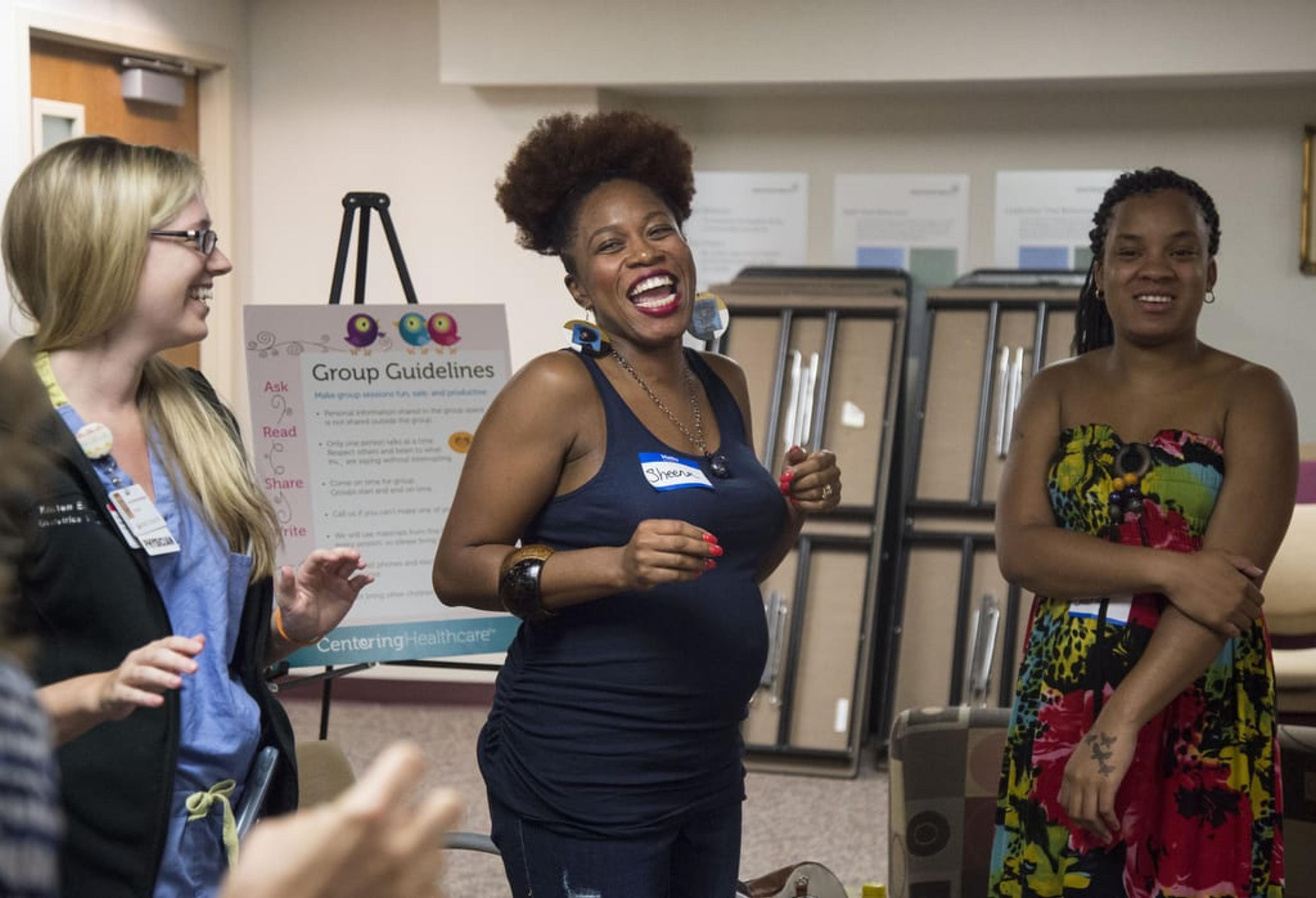 Sheena Webb, a member of Spectrum Health Centering Pregnancy smiling with other members