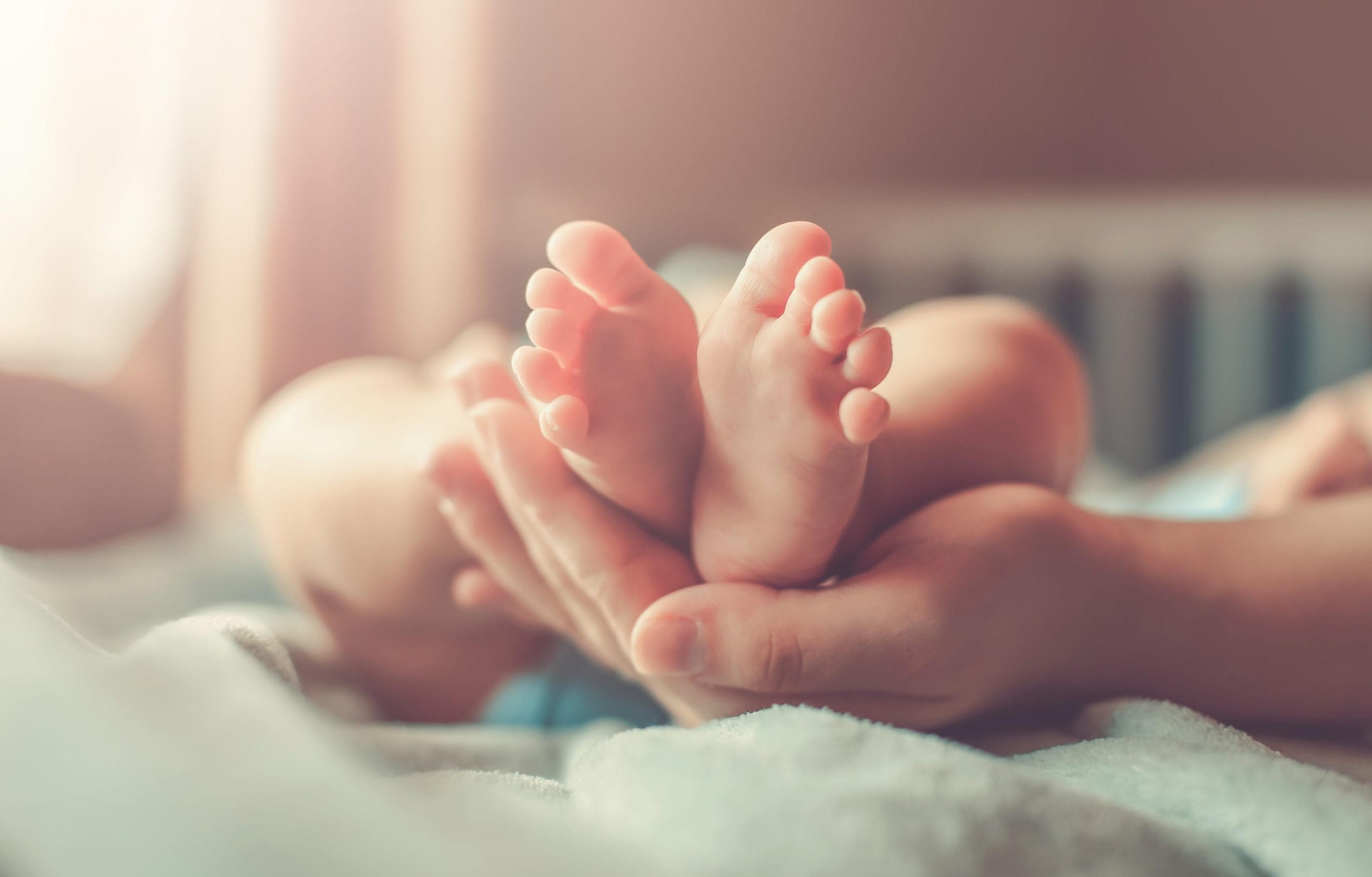 Soft-focus image of baby feet.