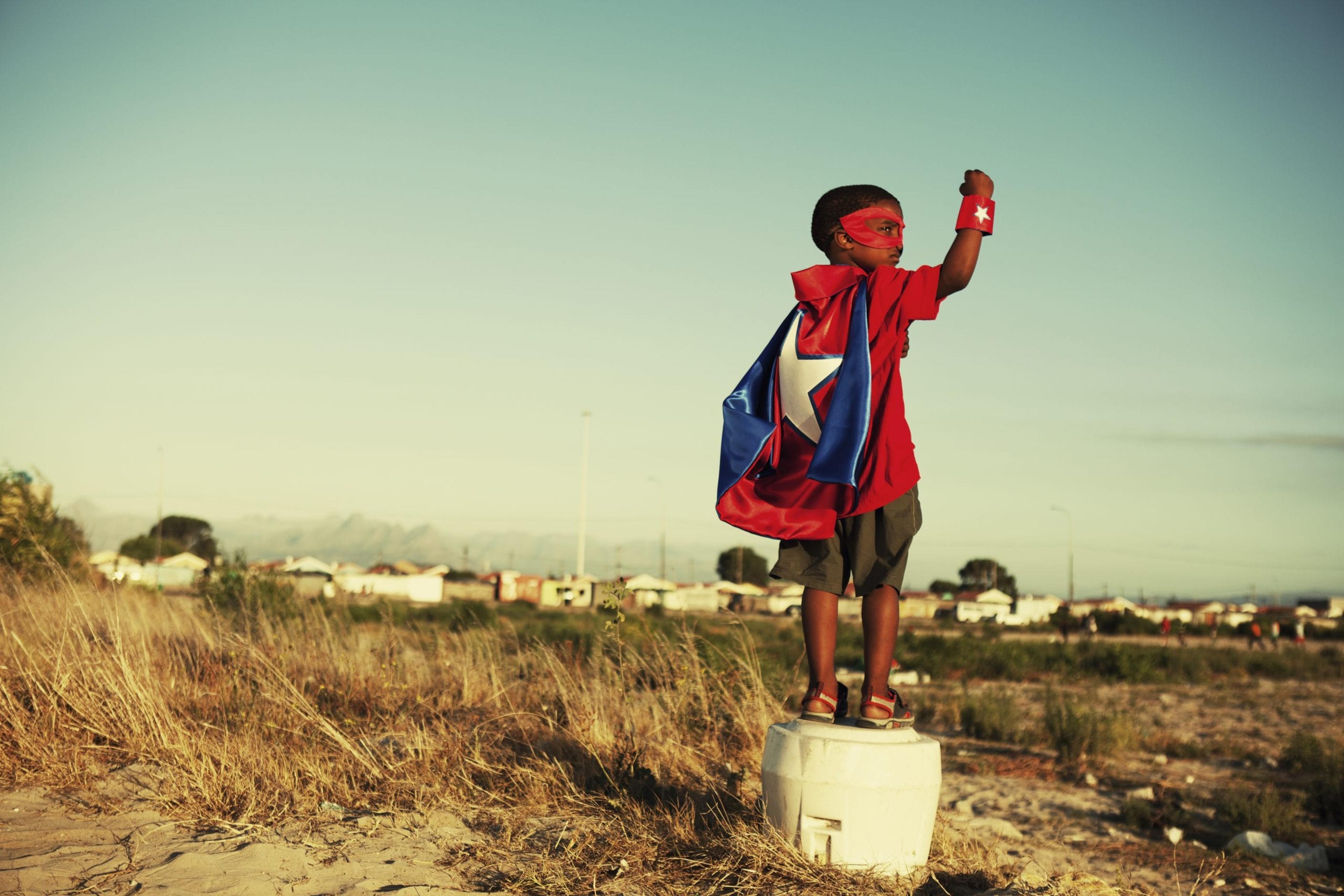 Image of kid pretending to be a superhero