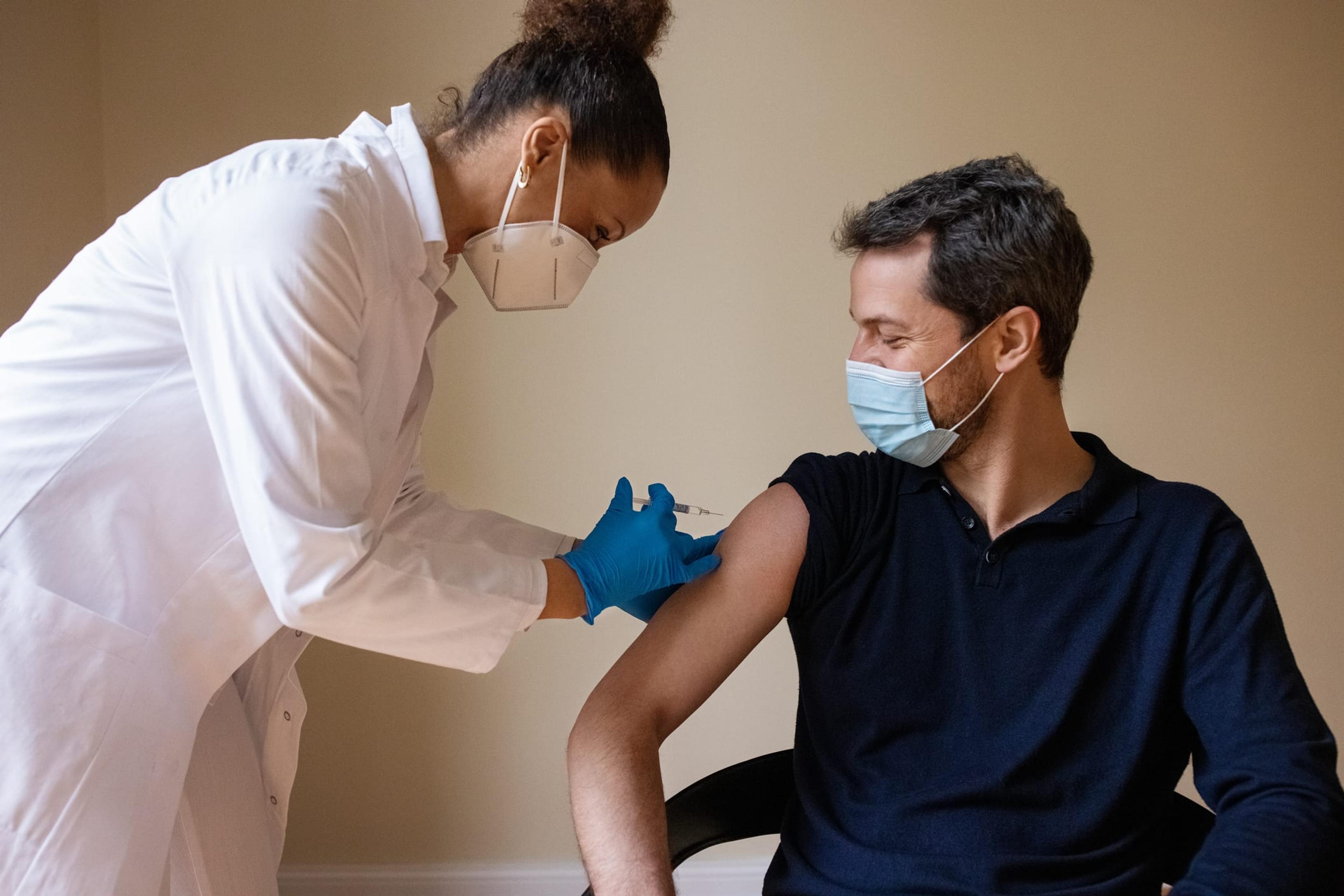 Man receiving a COVID vaccine