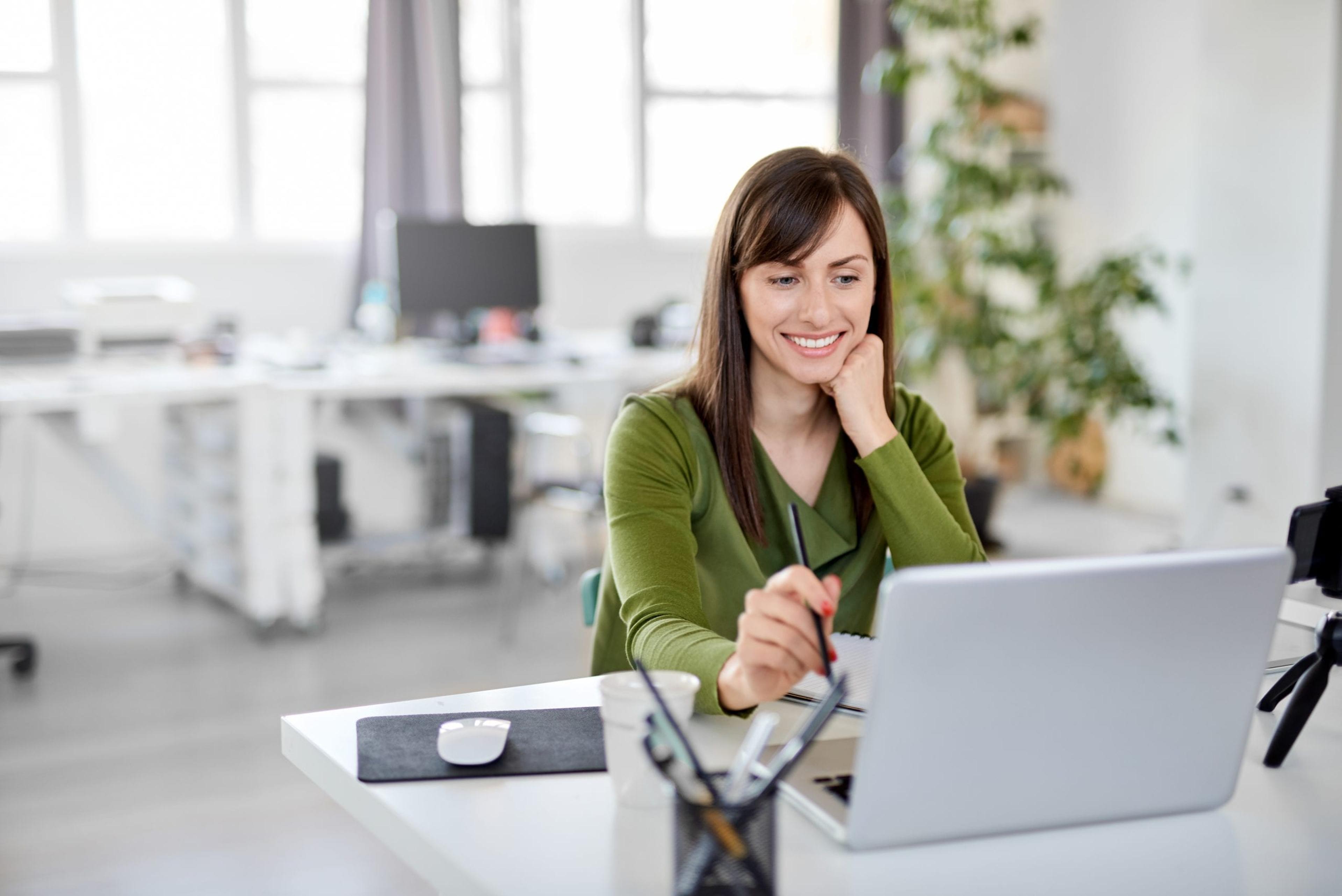 Woman working with plants in the background