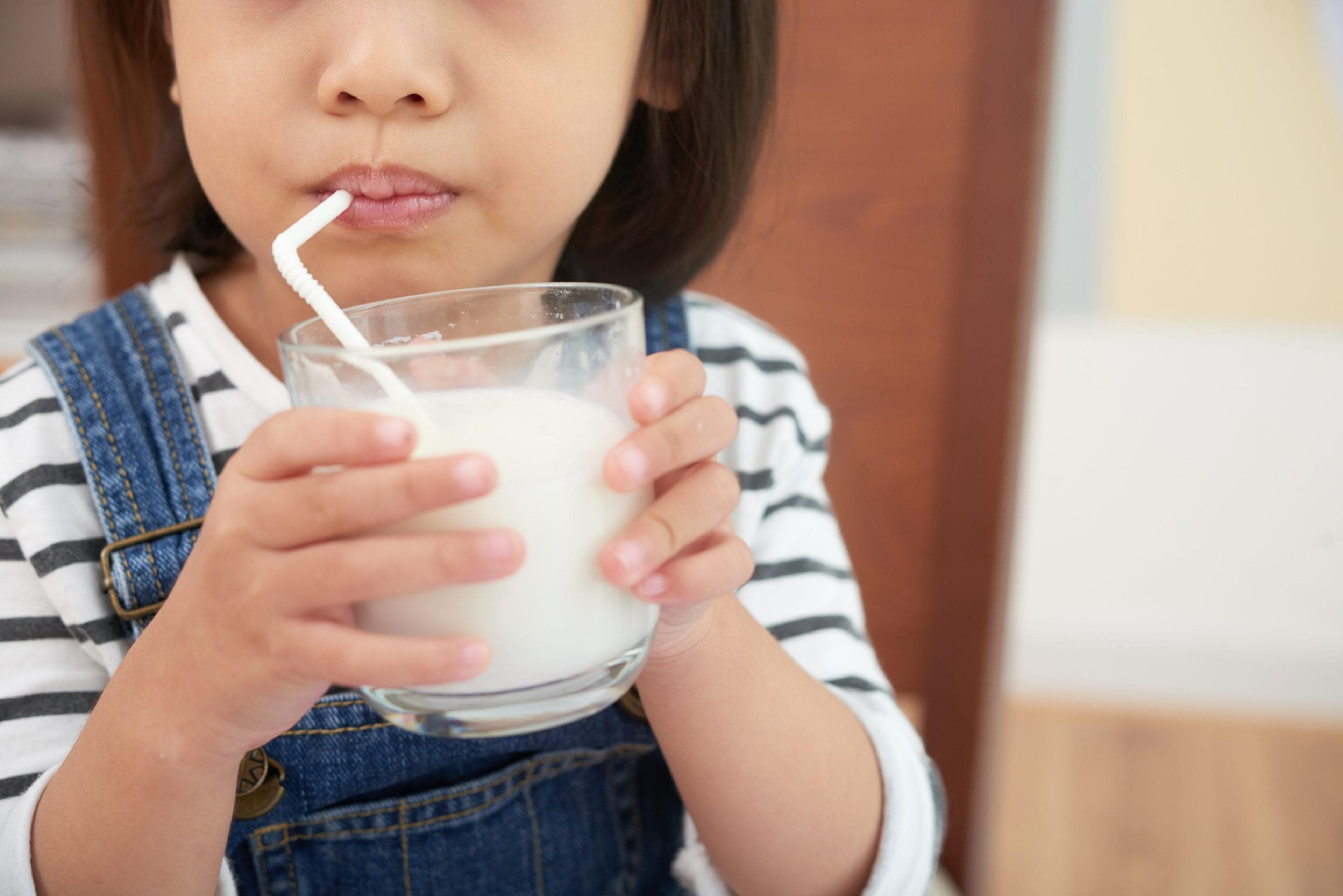 Little girl drinking milk