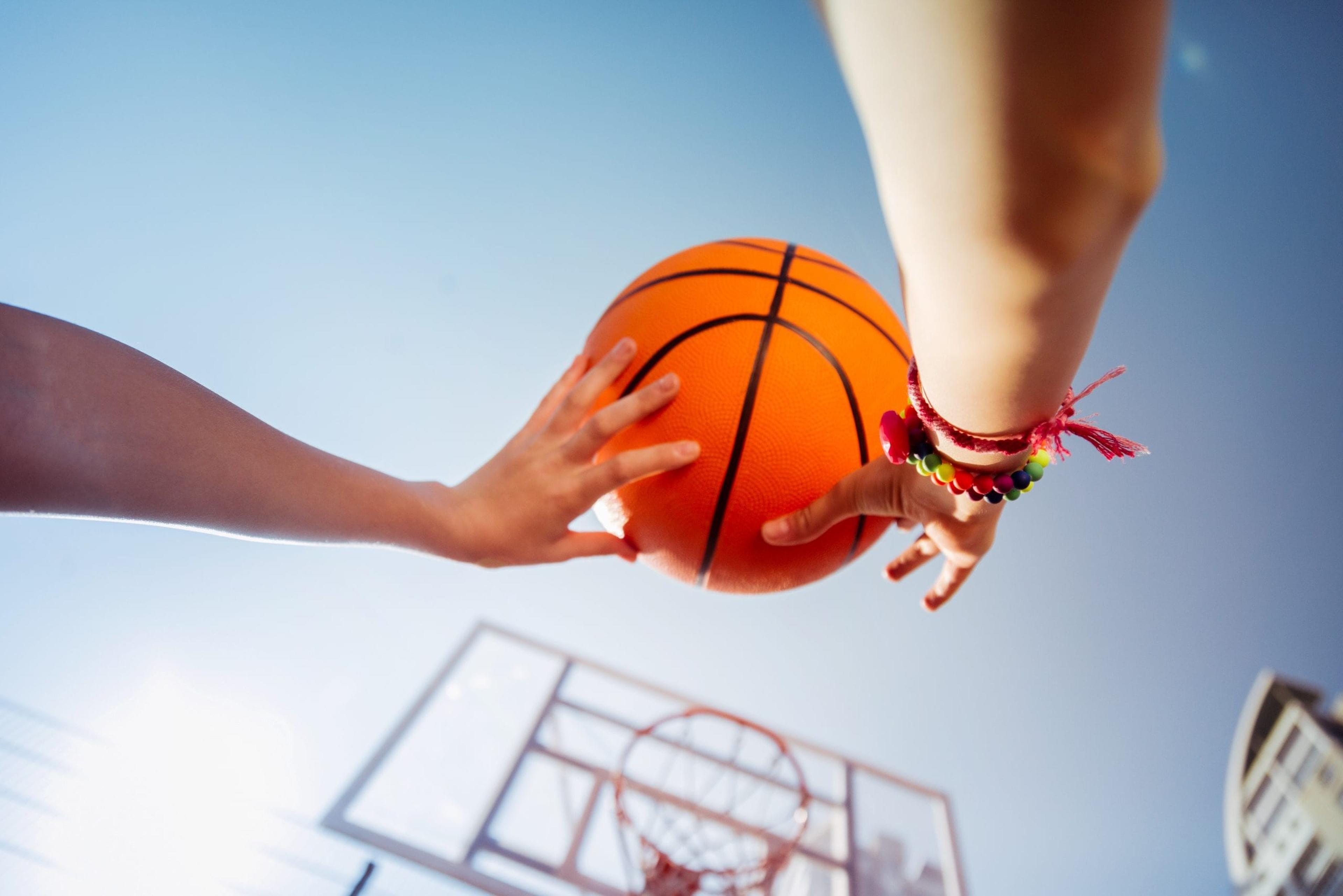 Middle school girl shooting a basketball