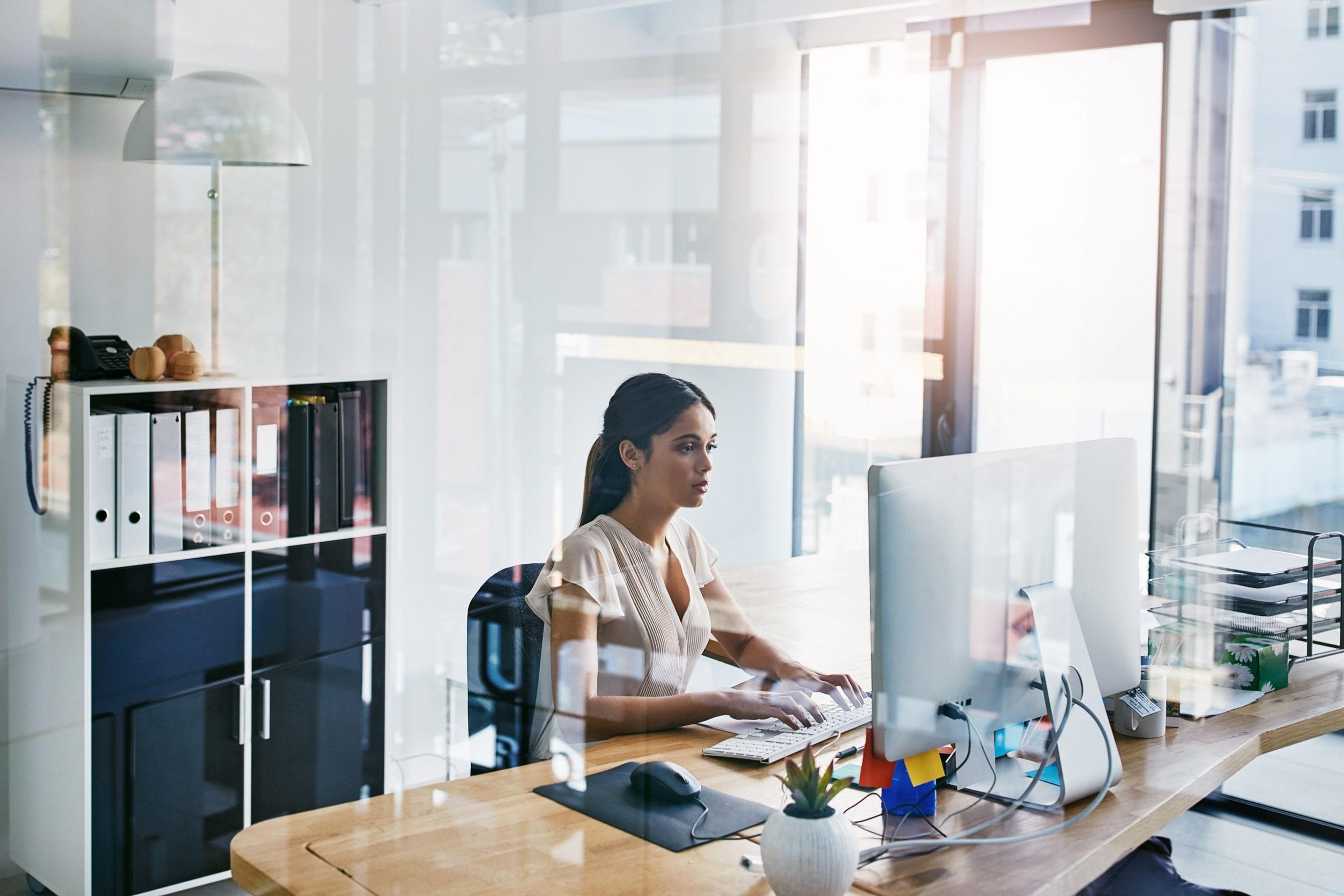 Woman sitting at her desk.