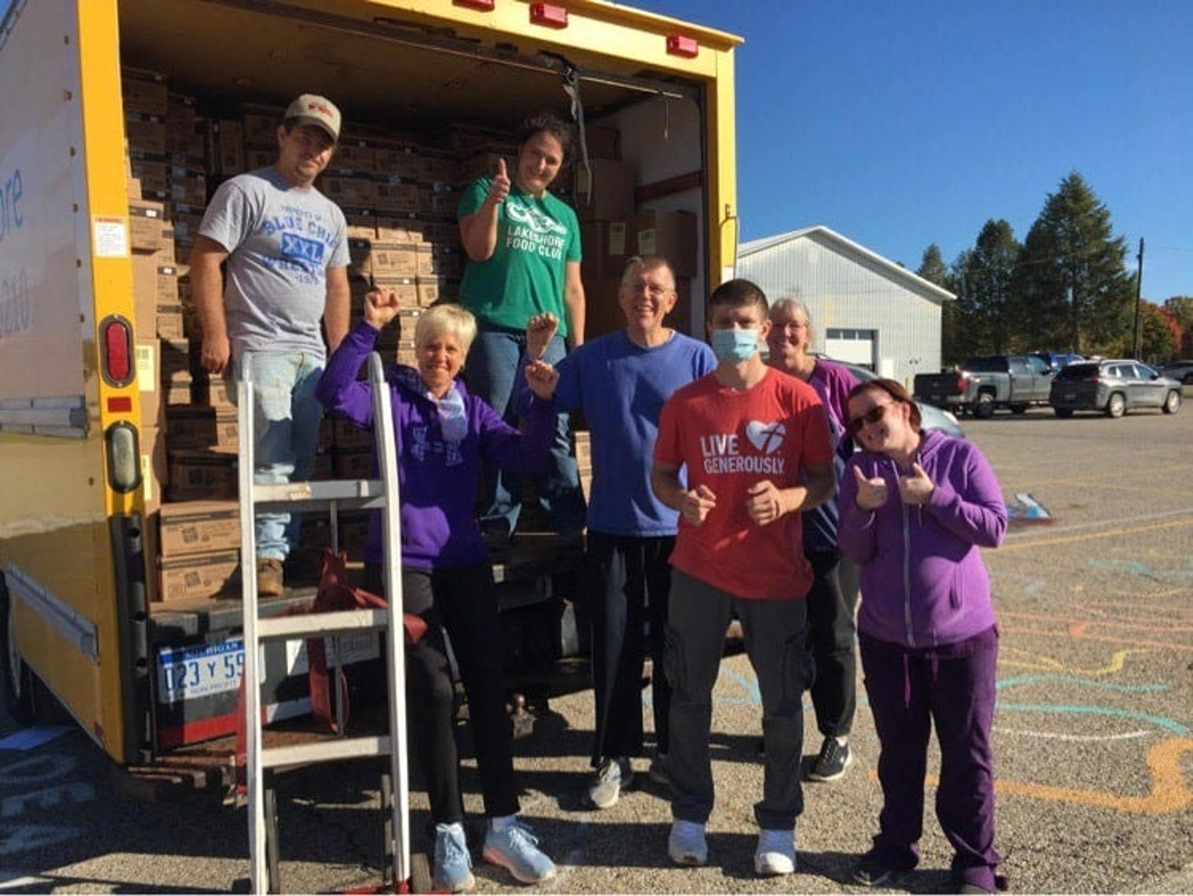 The Shelby team unloading food