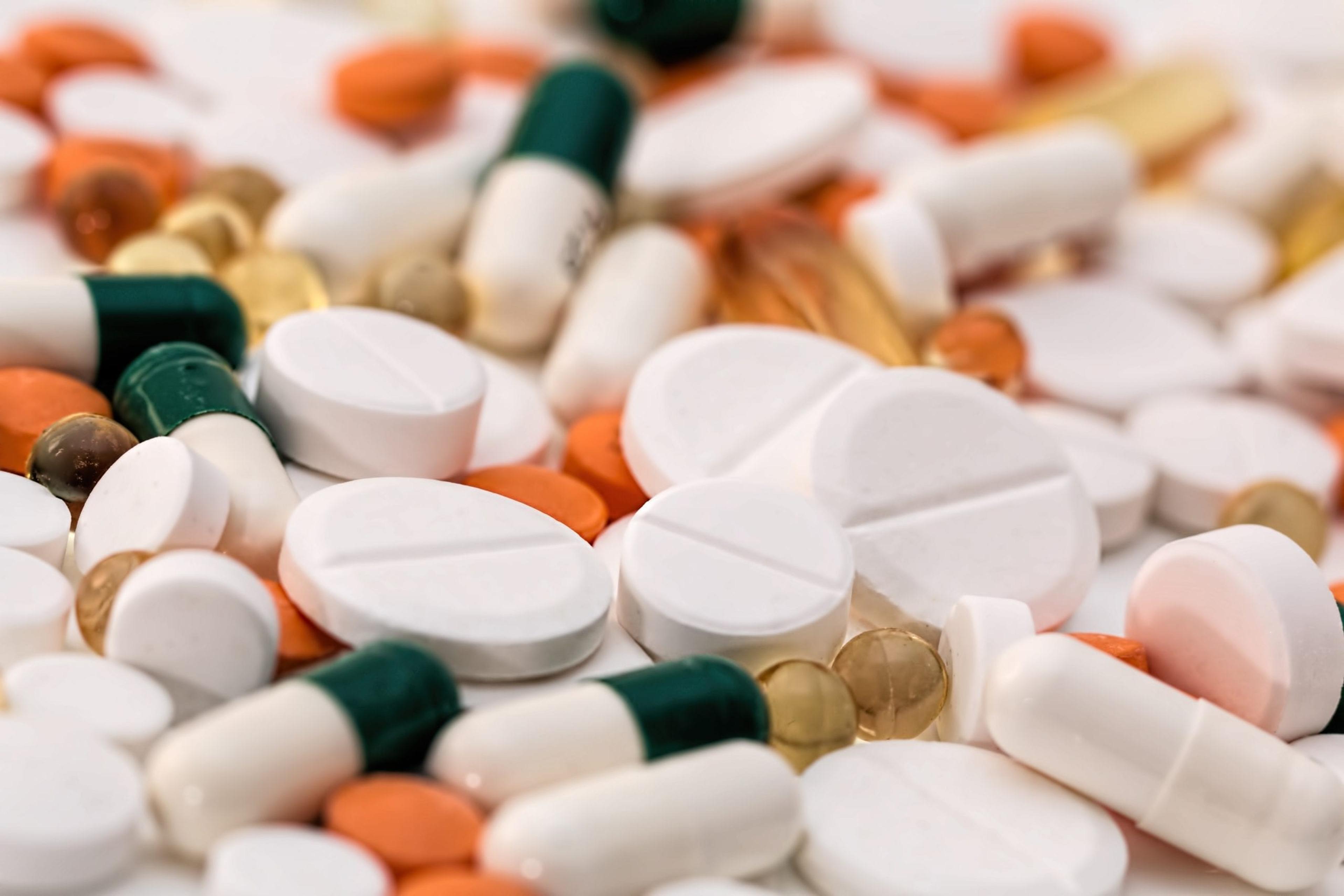 various pills on white background