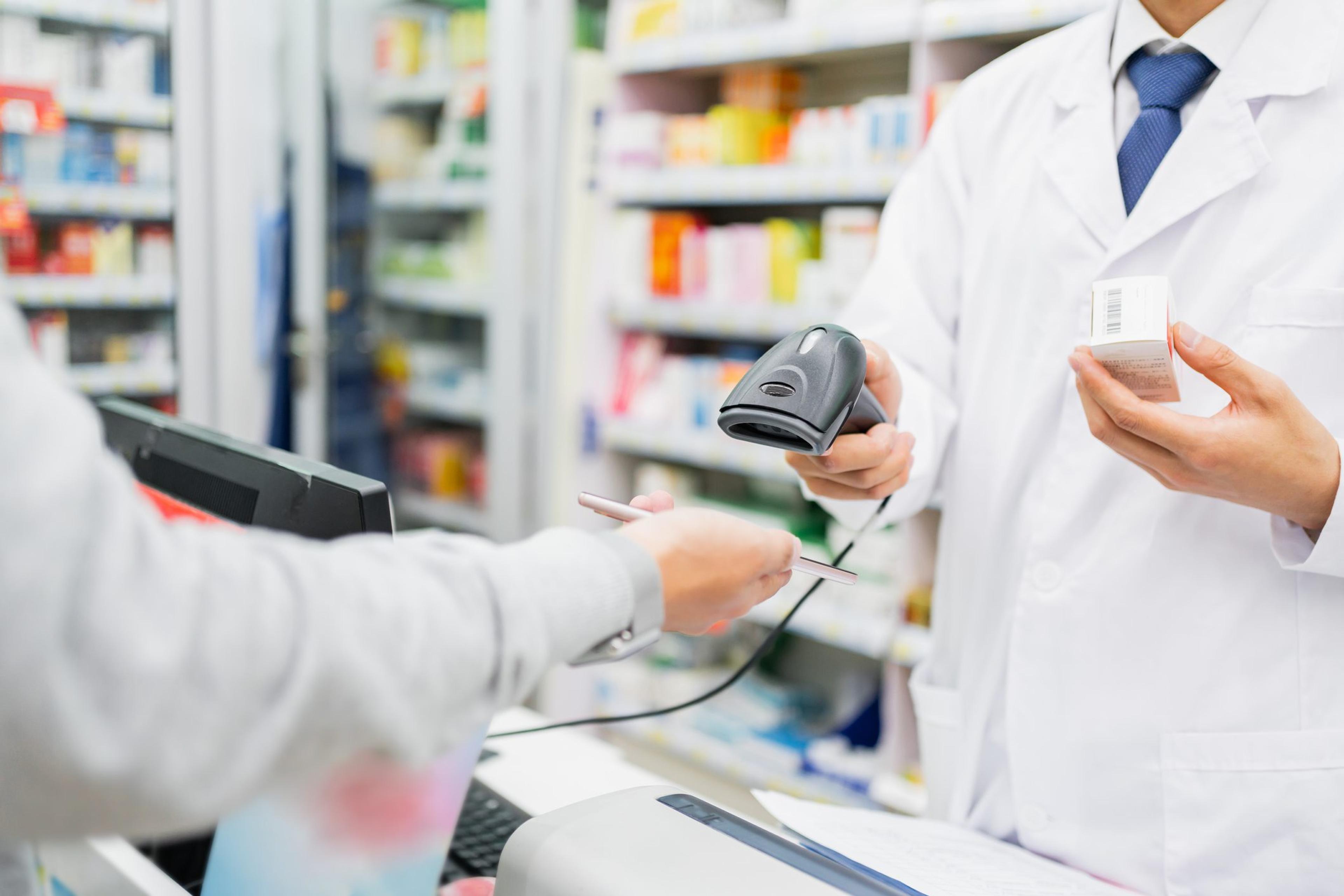 Pharmacist scans a prescription