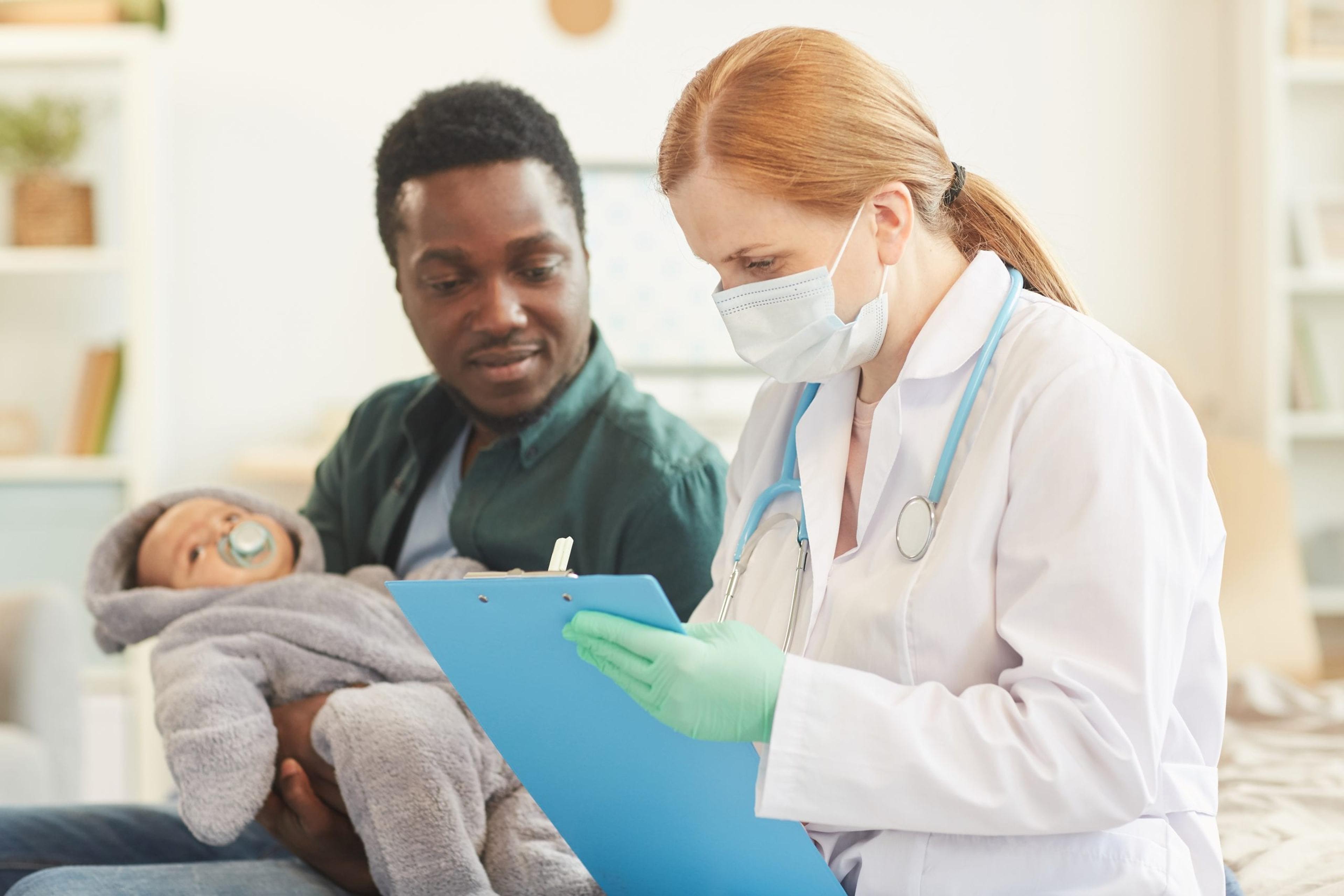 Doctor talking to a patient with a baby