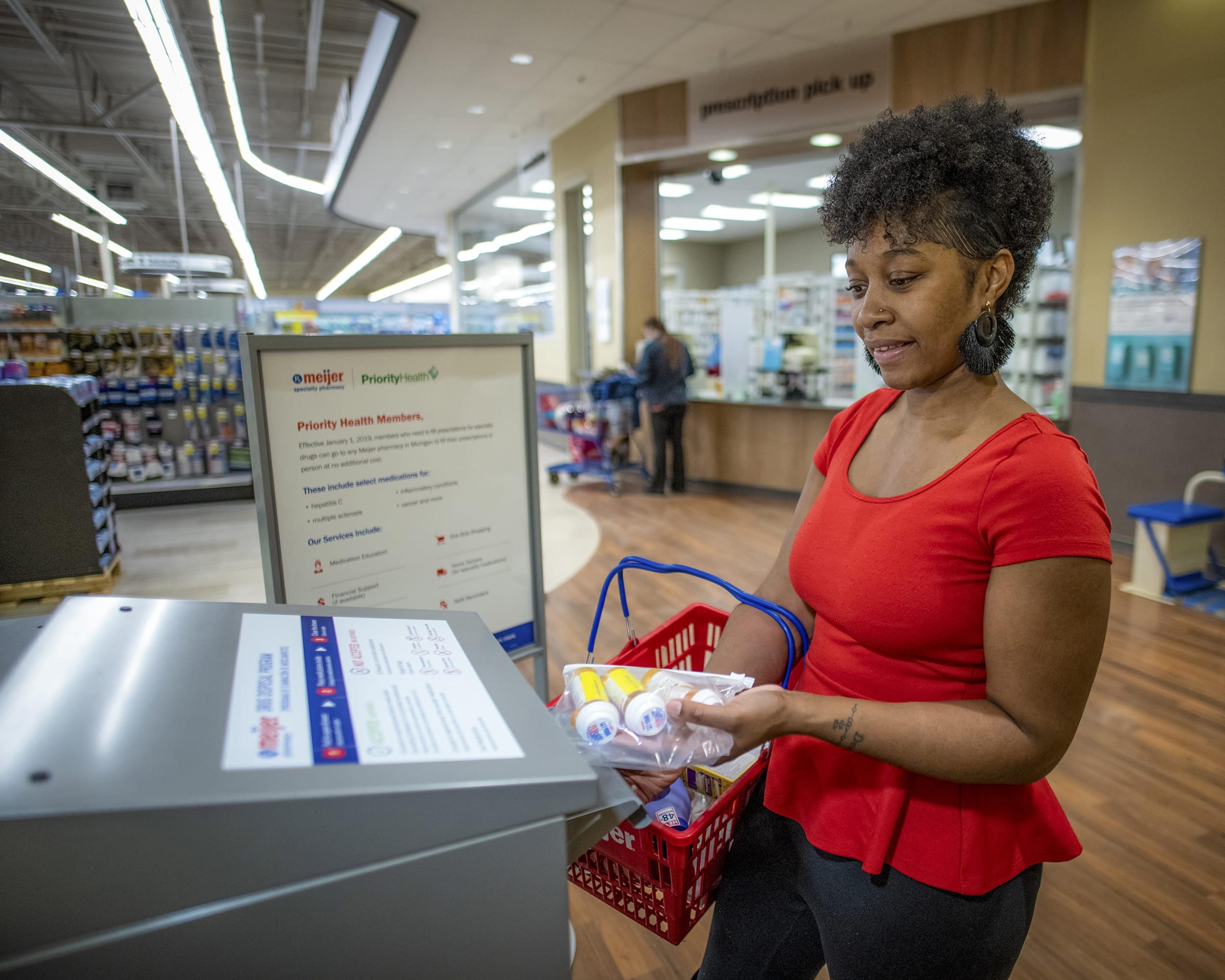Woman dropping off prescriptions at Meijer