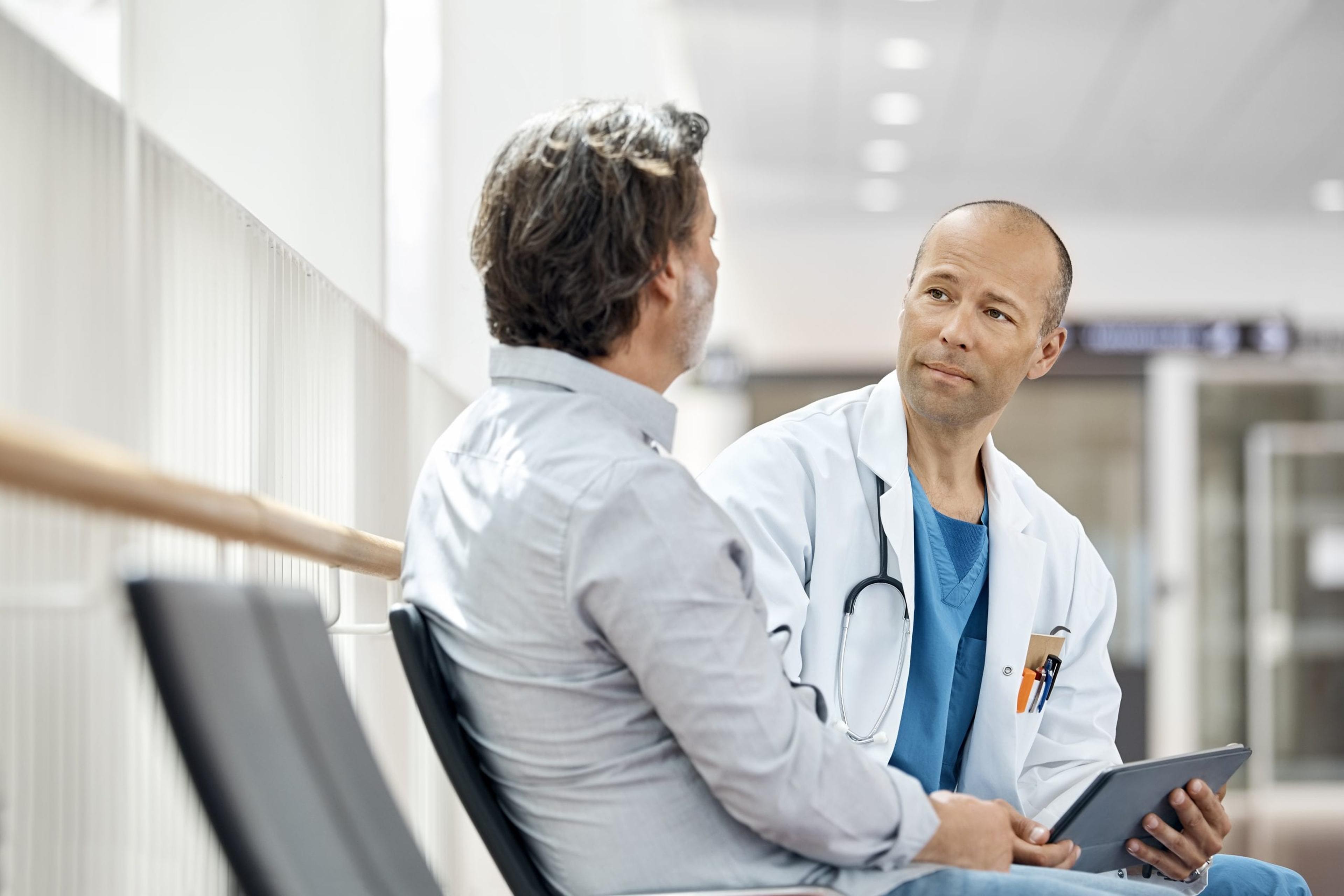 Doctor counseling a male patient