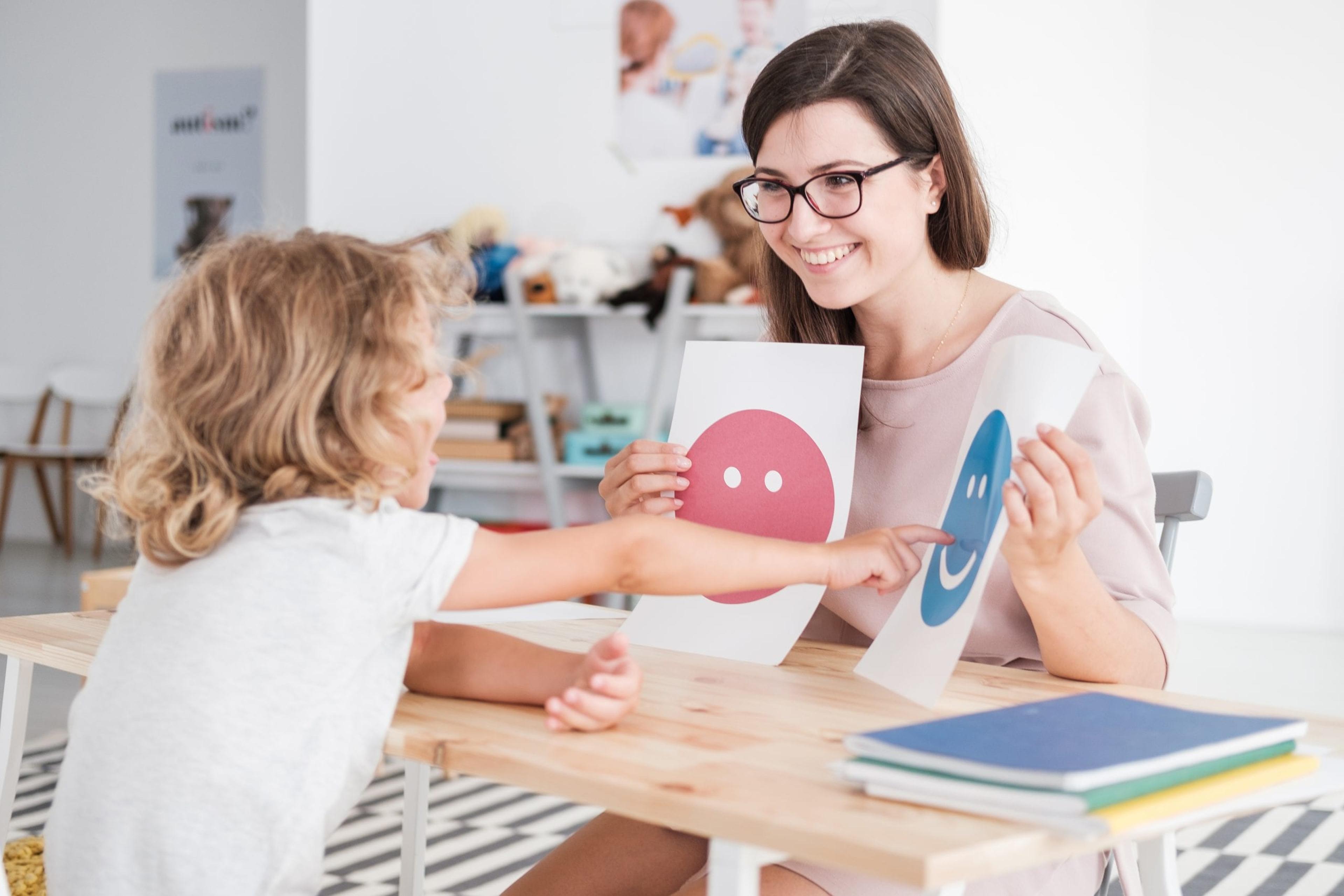 Therapist working with a patient with autism.