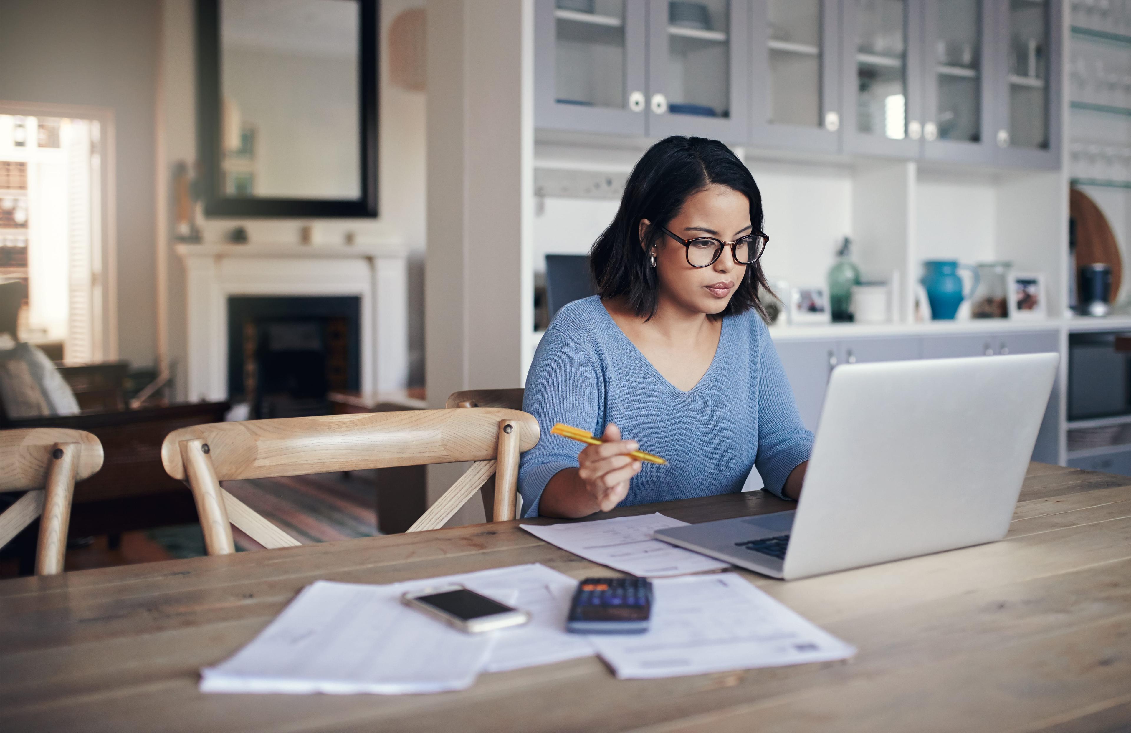 Young woman working on a laptop.