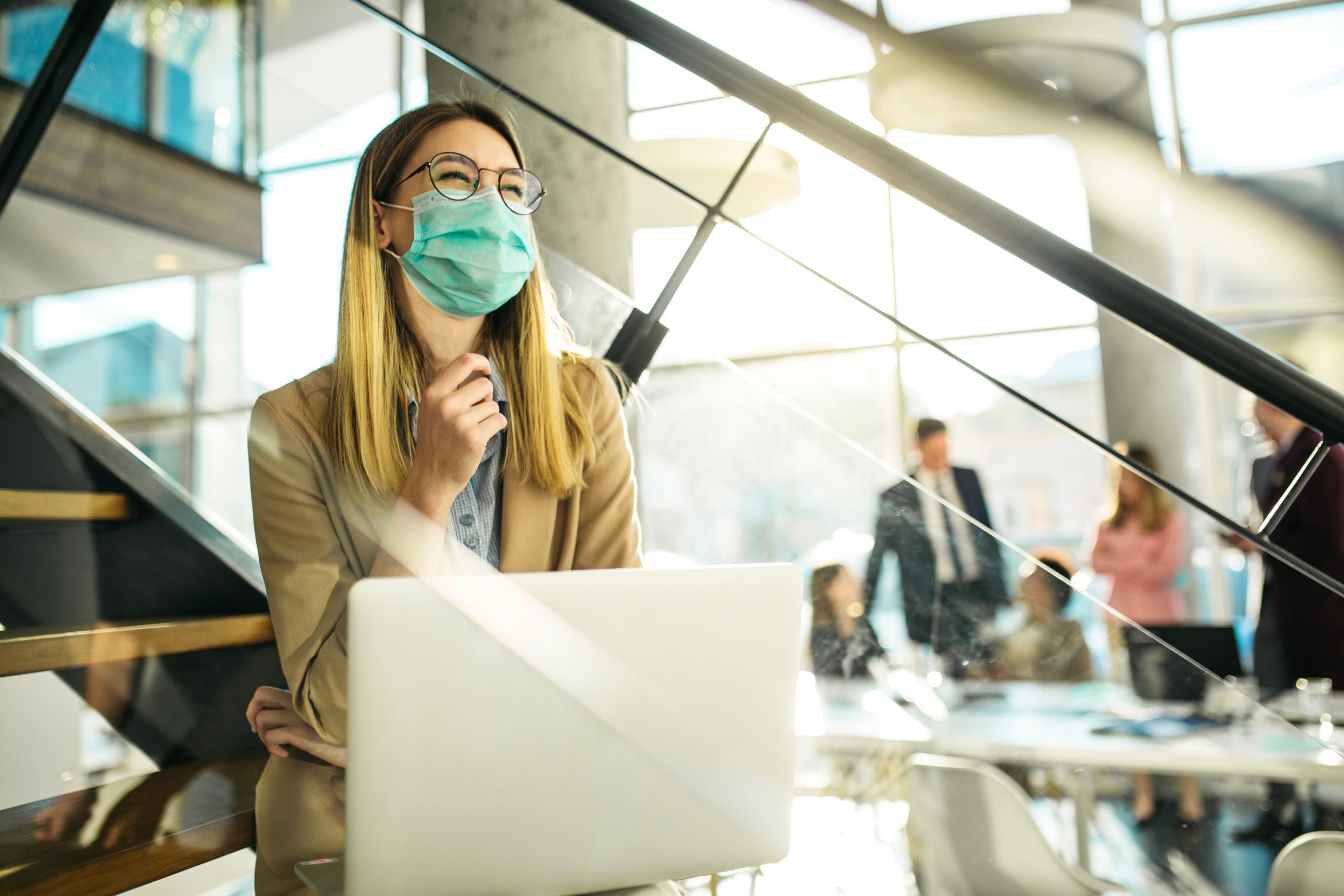 Woman wearing a mask at work