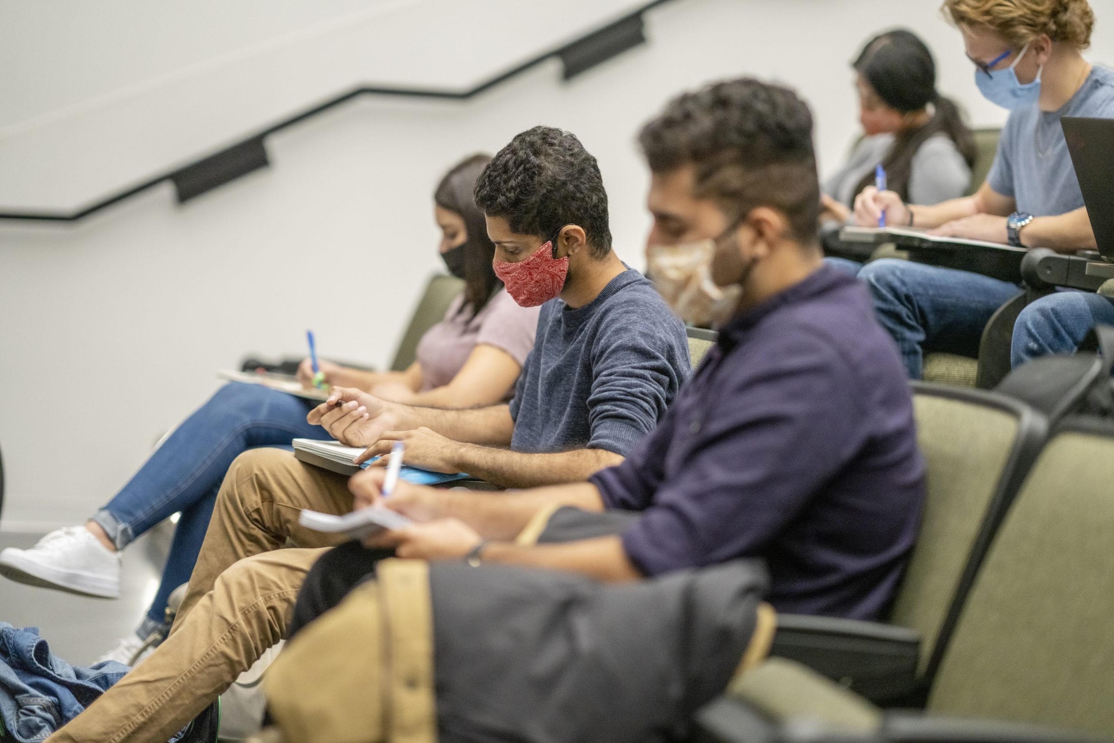 College students wearing masks in a classroom