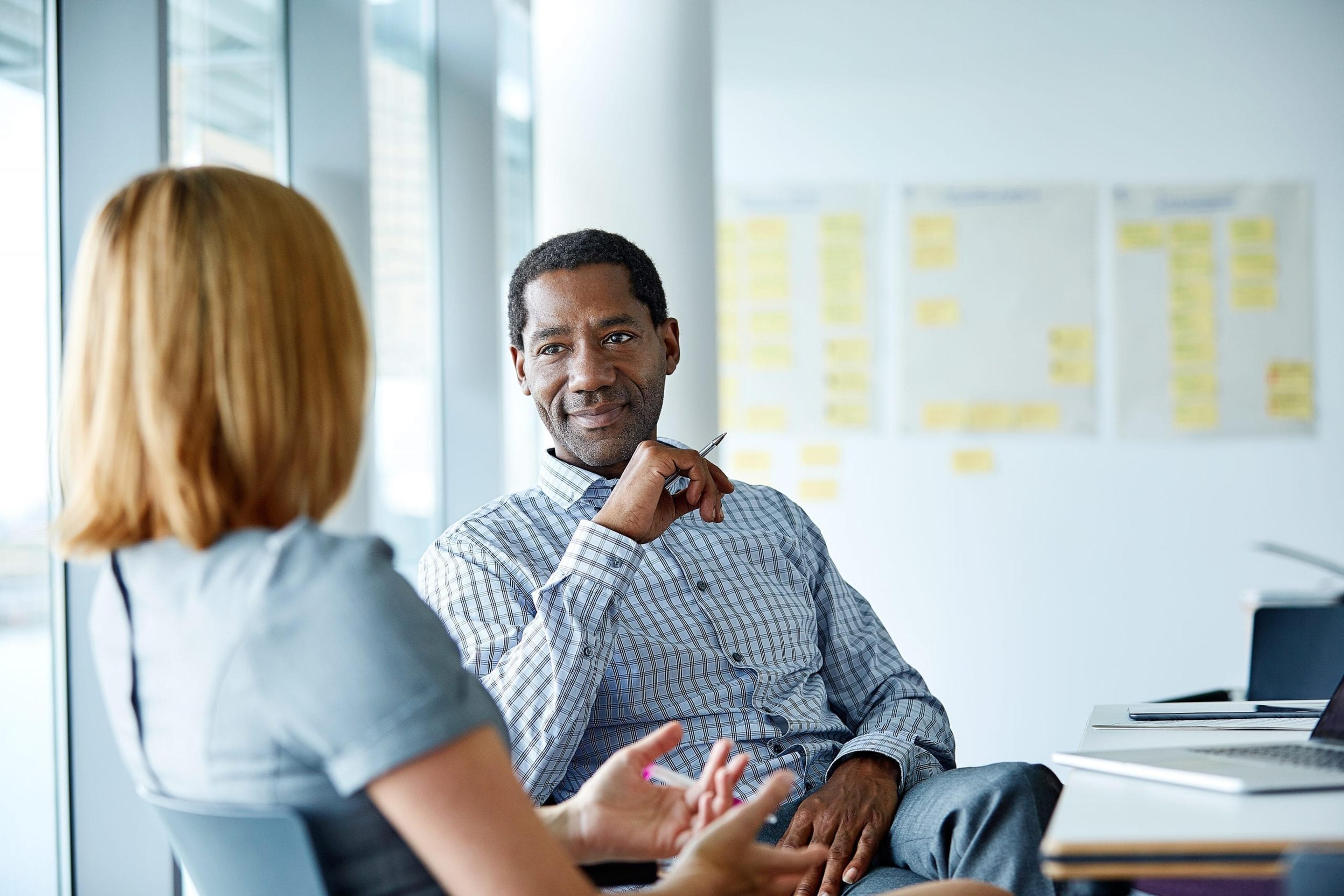 Man talking to co-worker