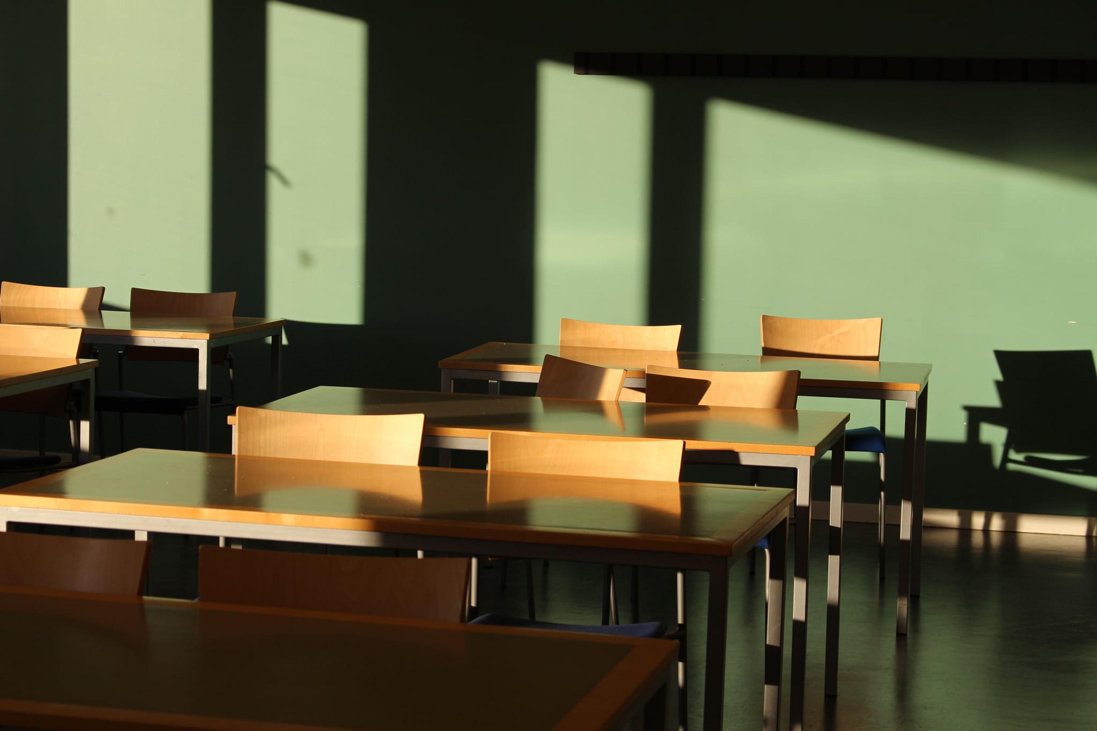 Empty chairs at long tables