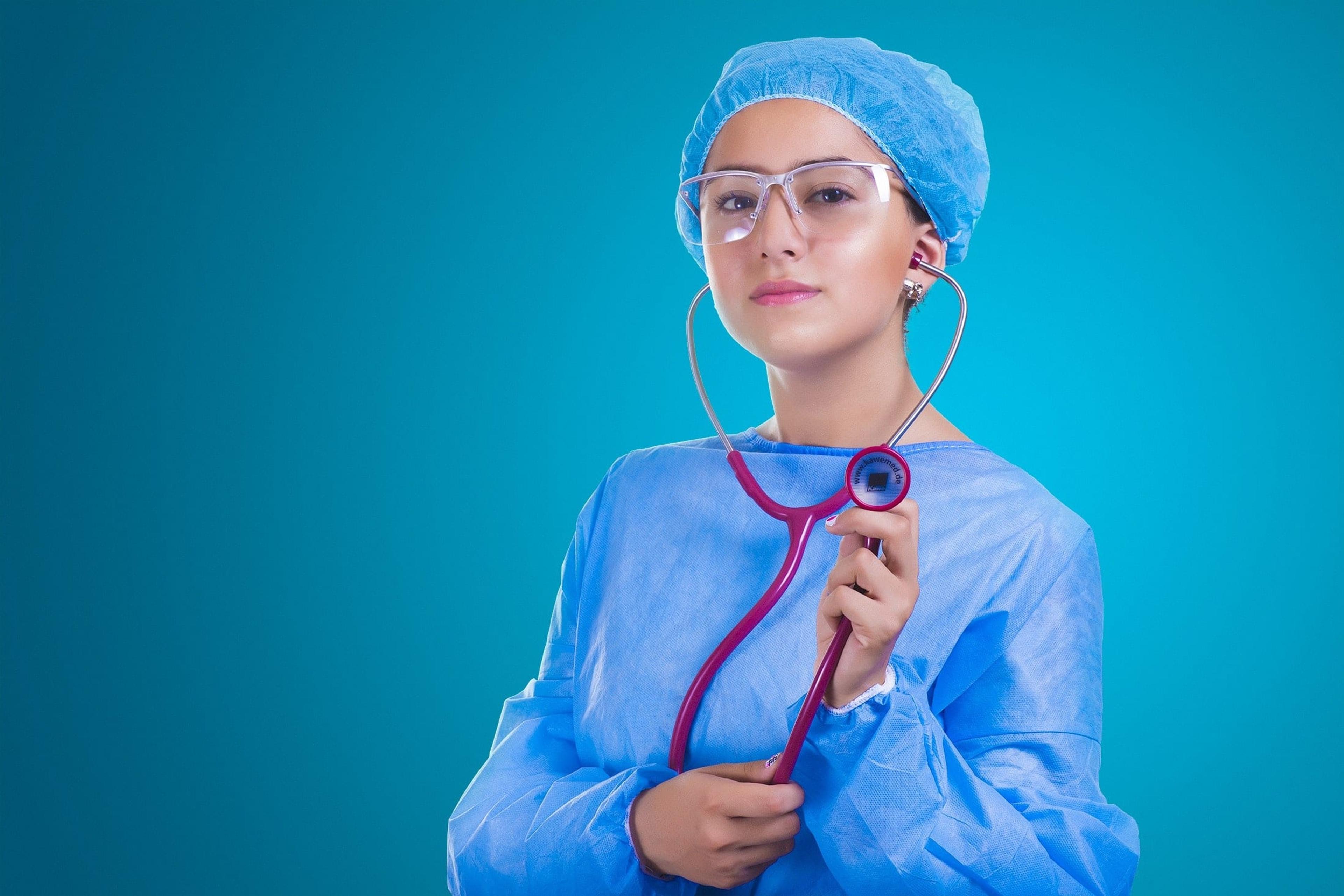 woman holding stethoscope