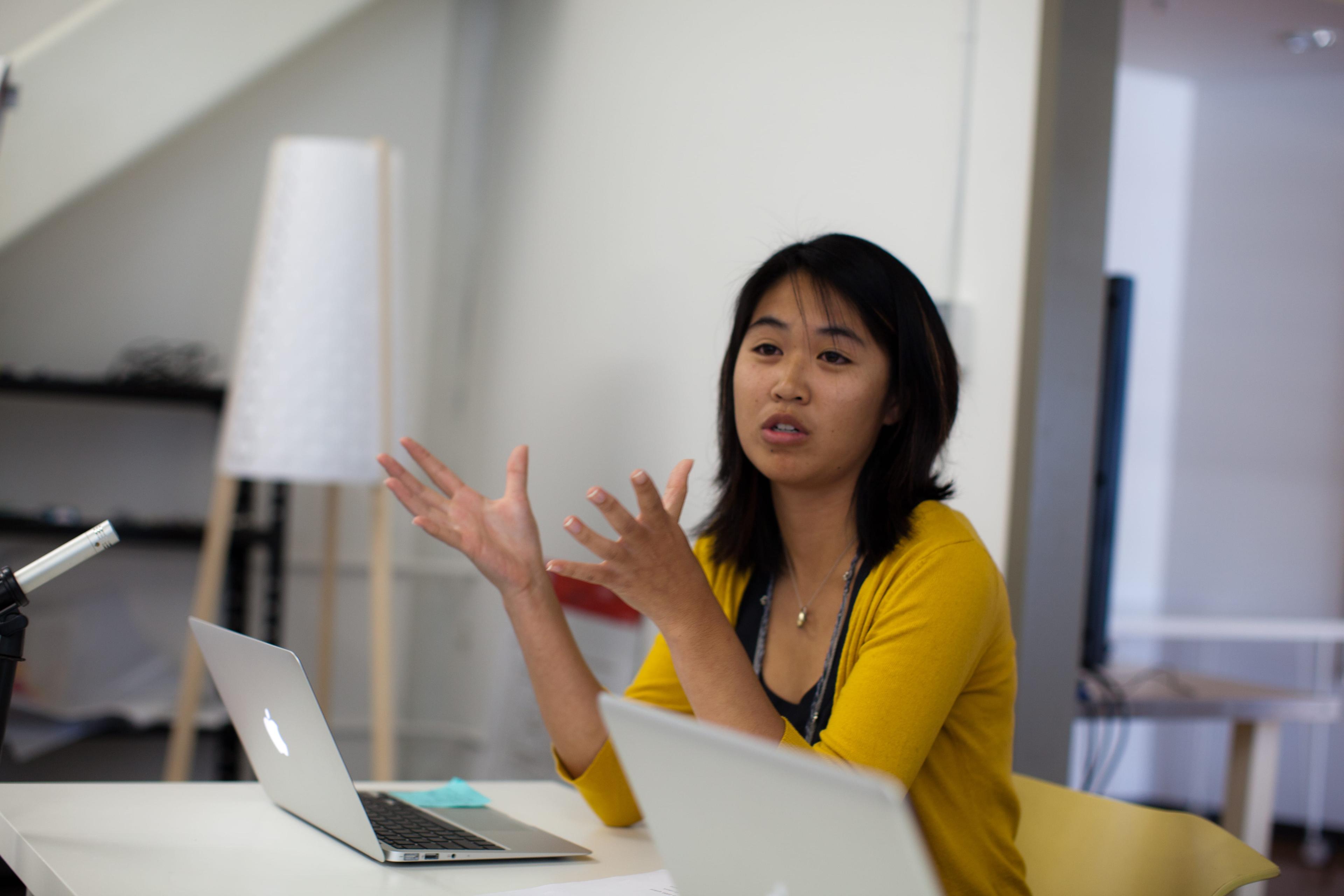 Girl working on laptop and talking