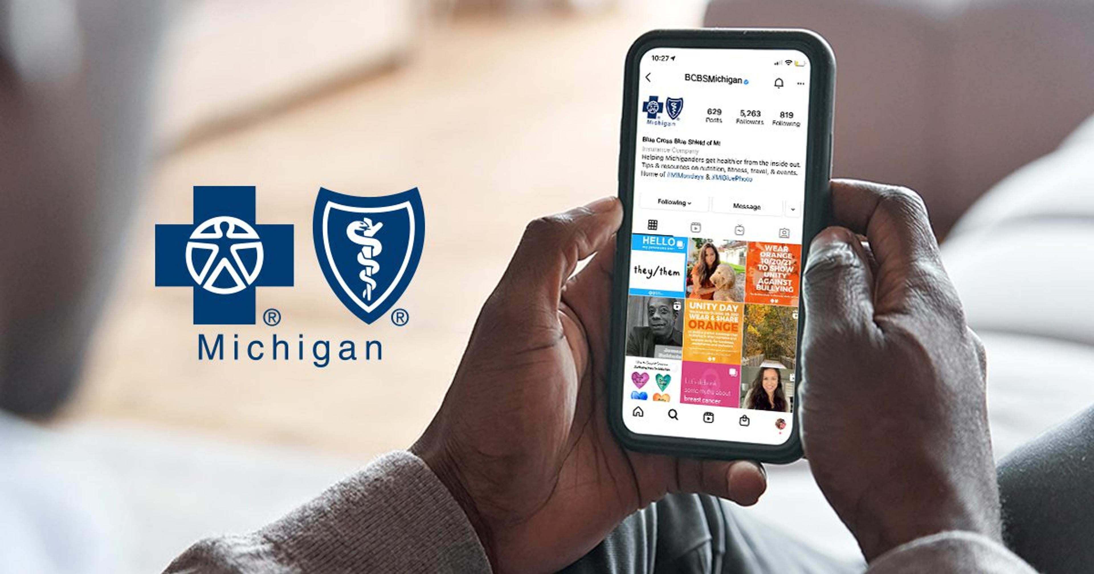 Blue Cross Blue Shield of Michigan logo next to phone with Instagram account open