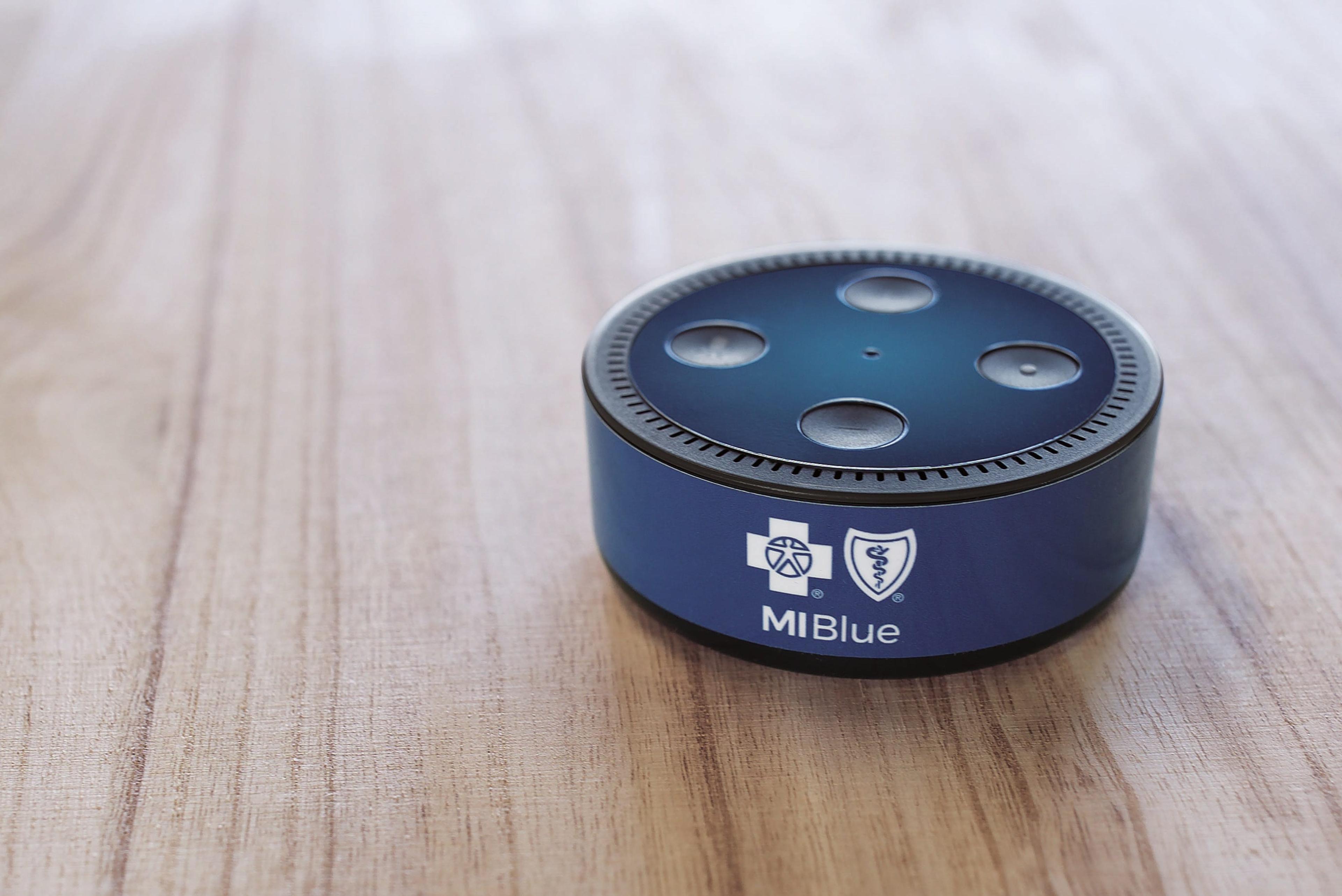 Image of a Blue Cross branded Amazon Echo Dot.