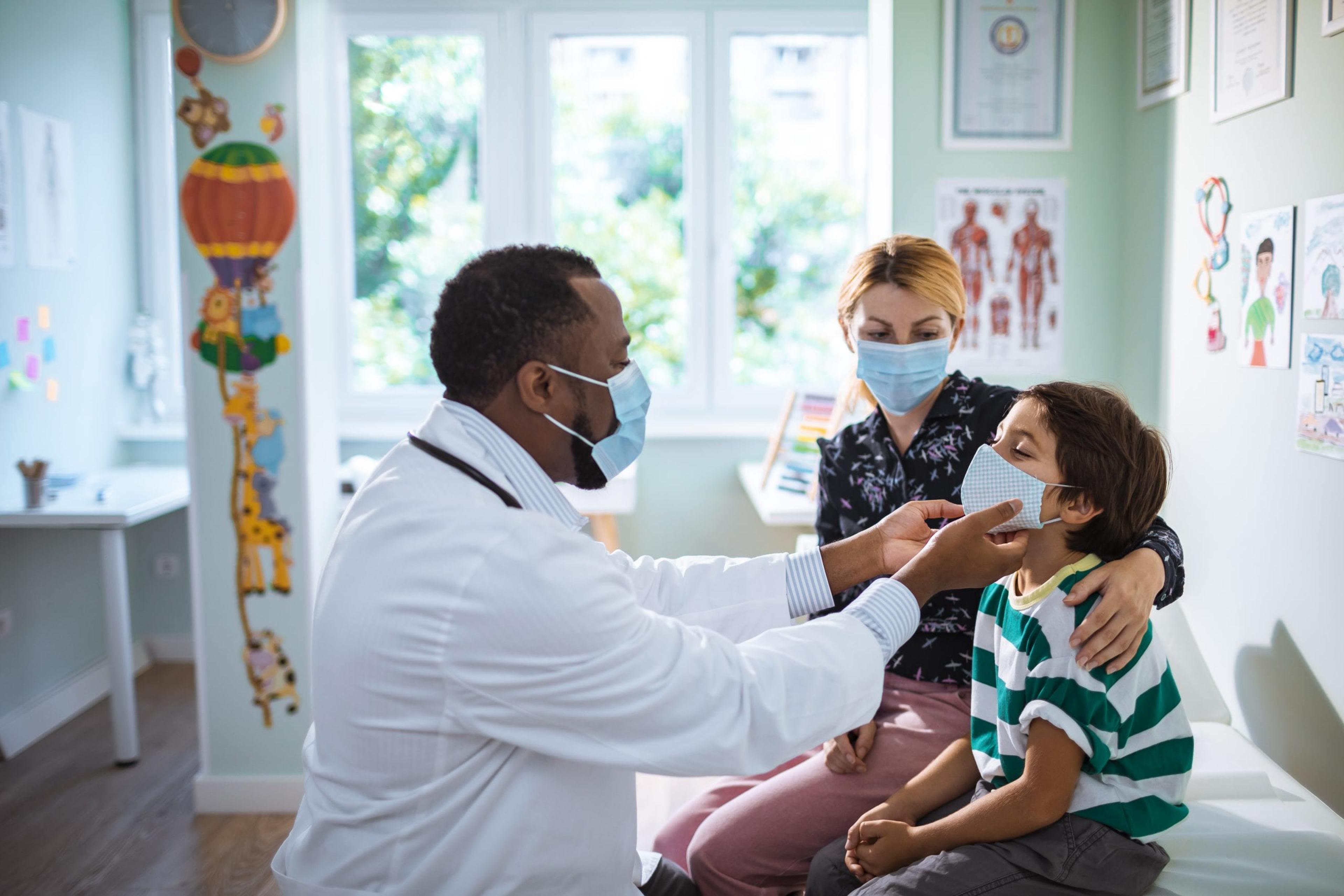 Pediatrician examining a child