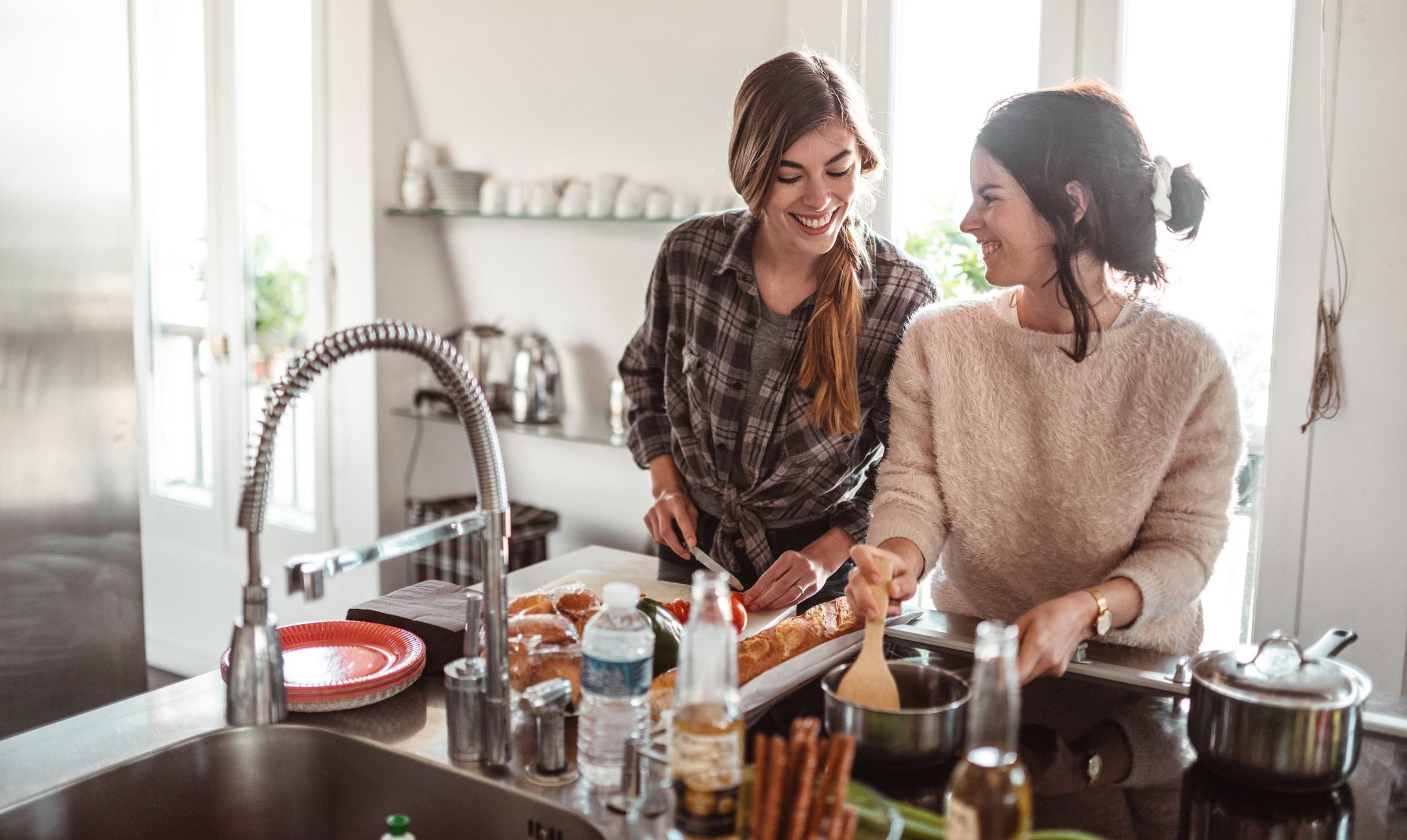 Two women cooking together in a kitchen