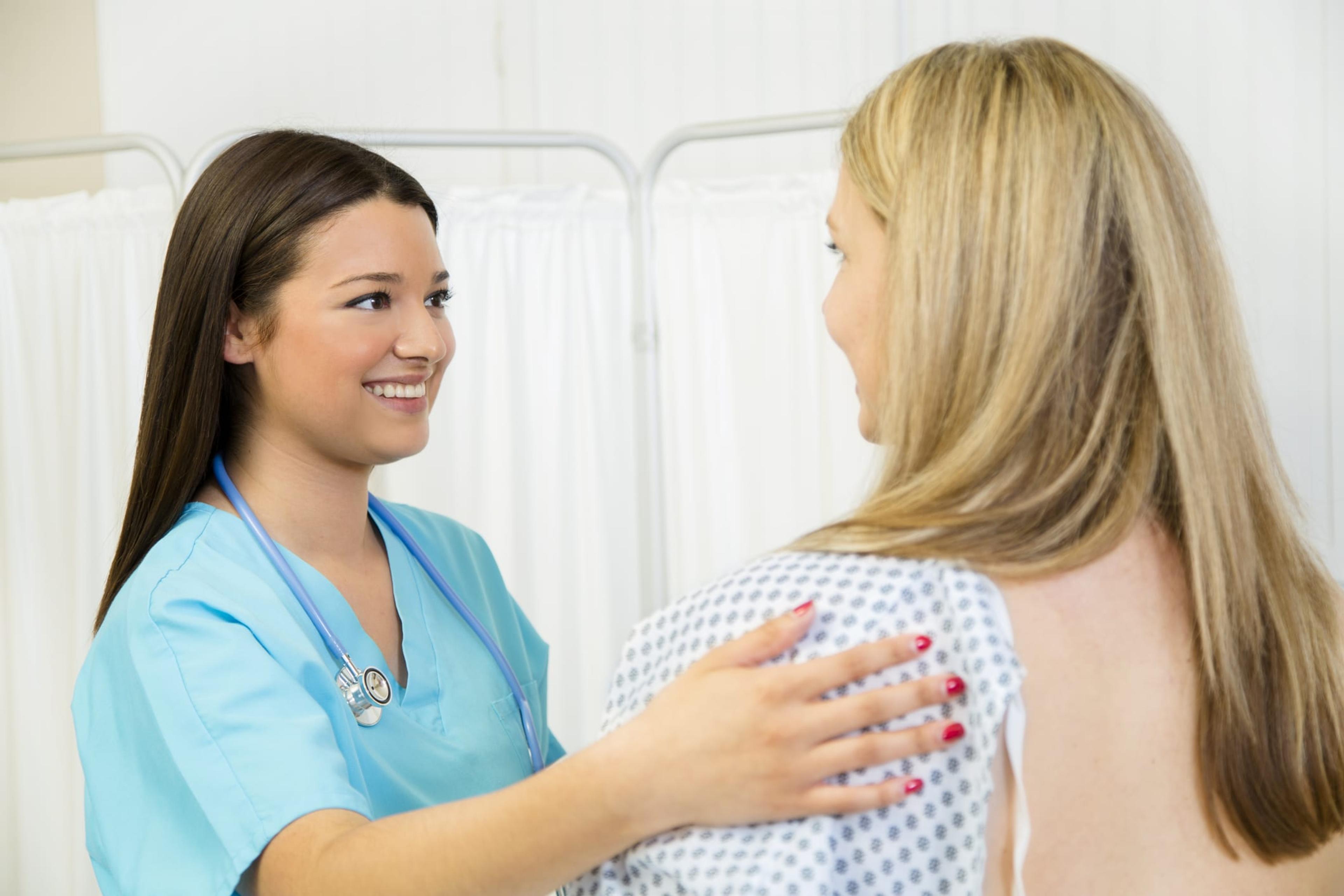 Woman receives annual breast exam