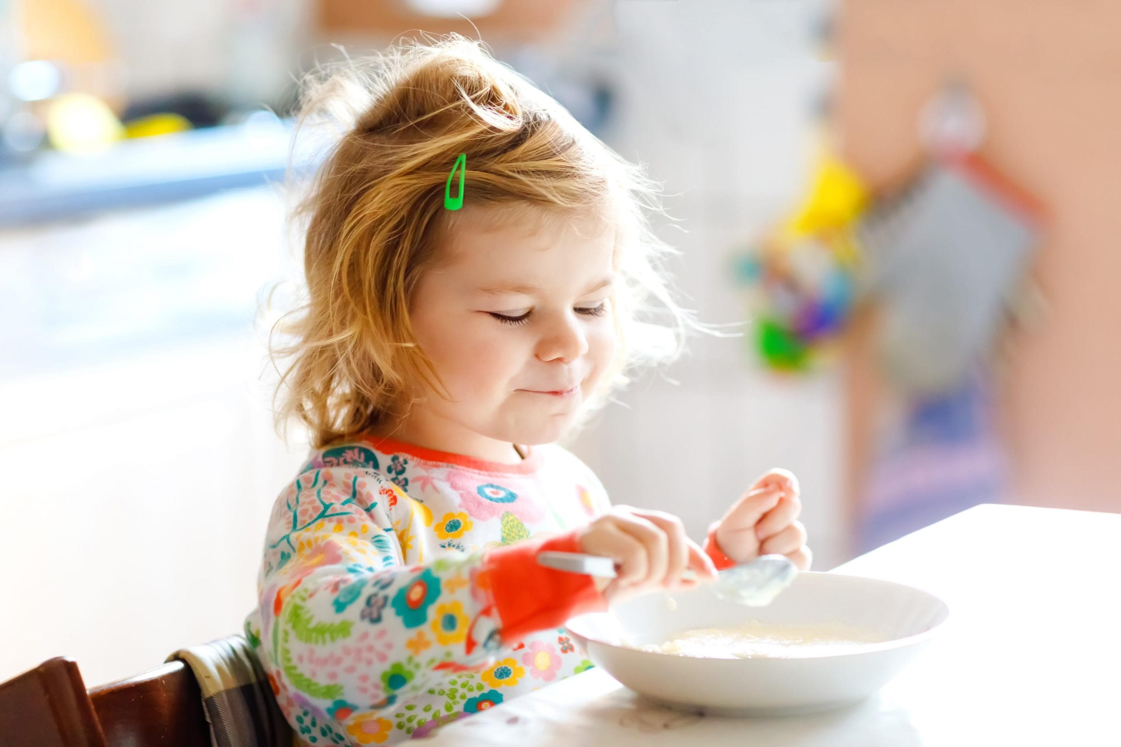 Little girl eating cereal