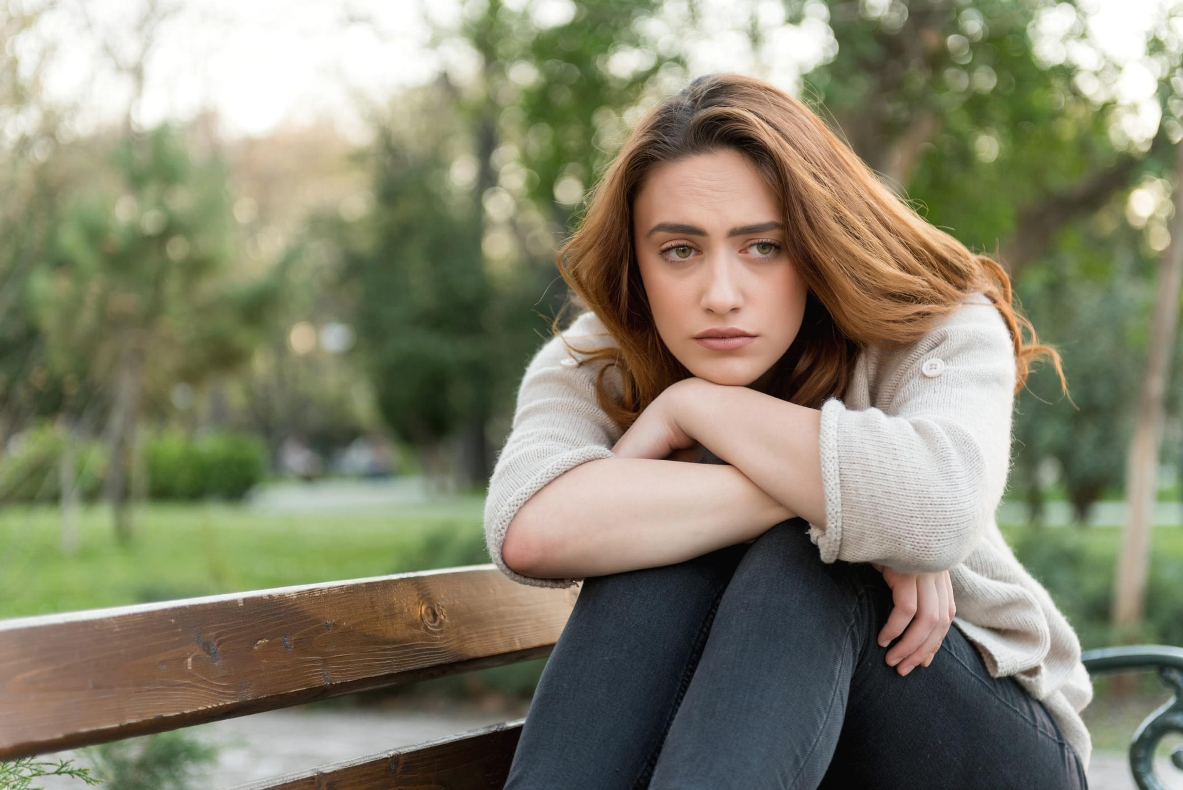 Thoughtful woman in the park