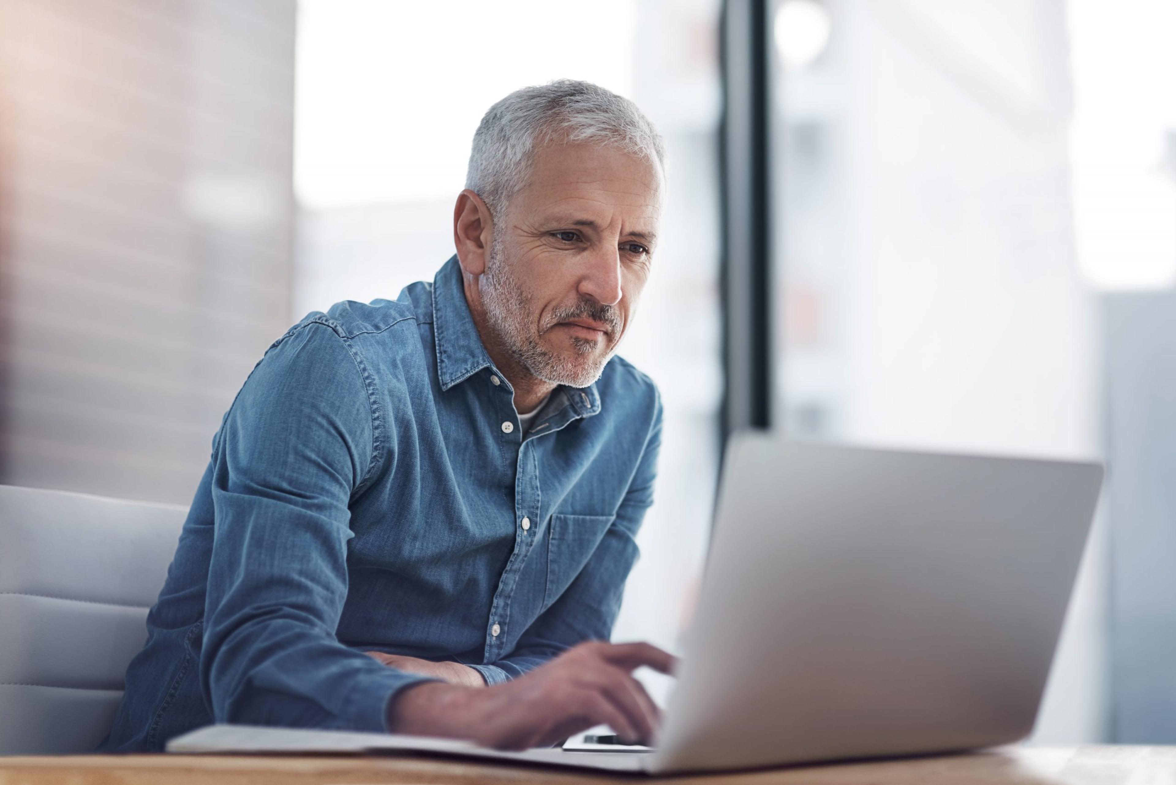 Boss looking at a computer screen