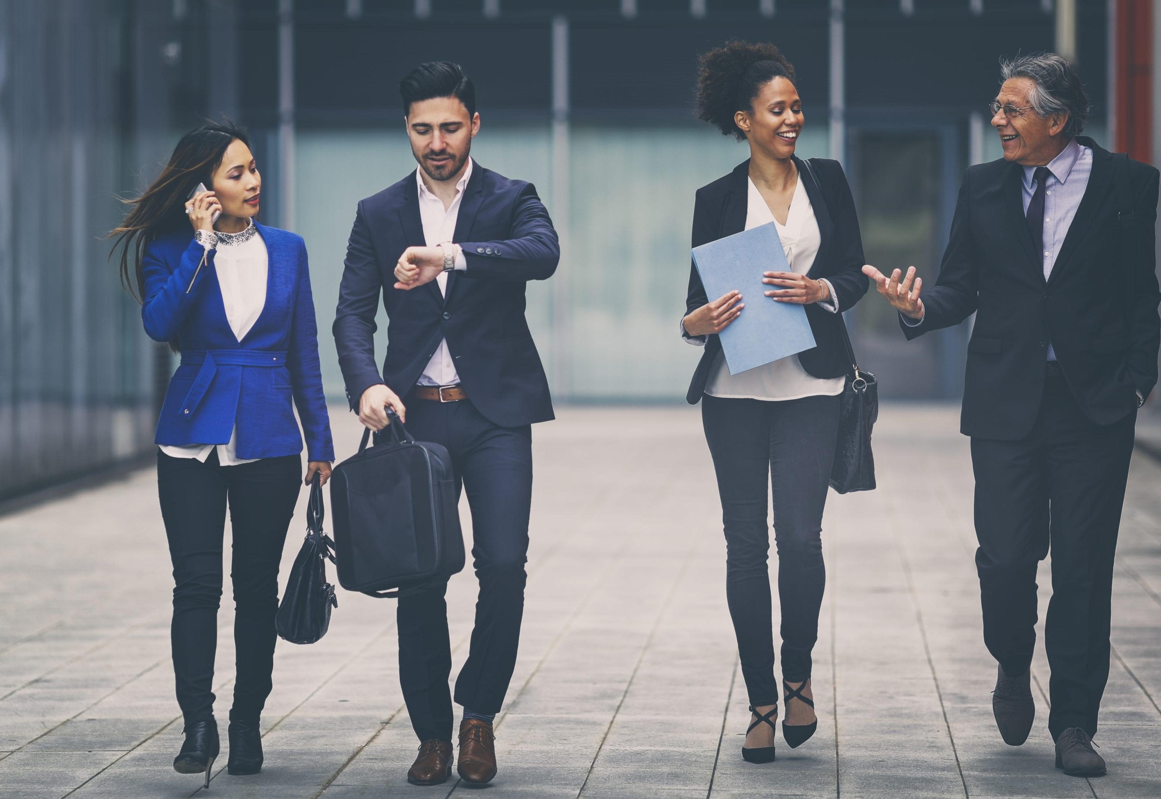 Group of business people walking to work