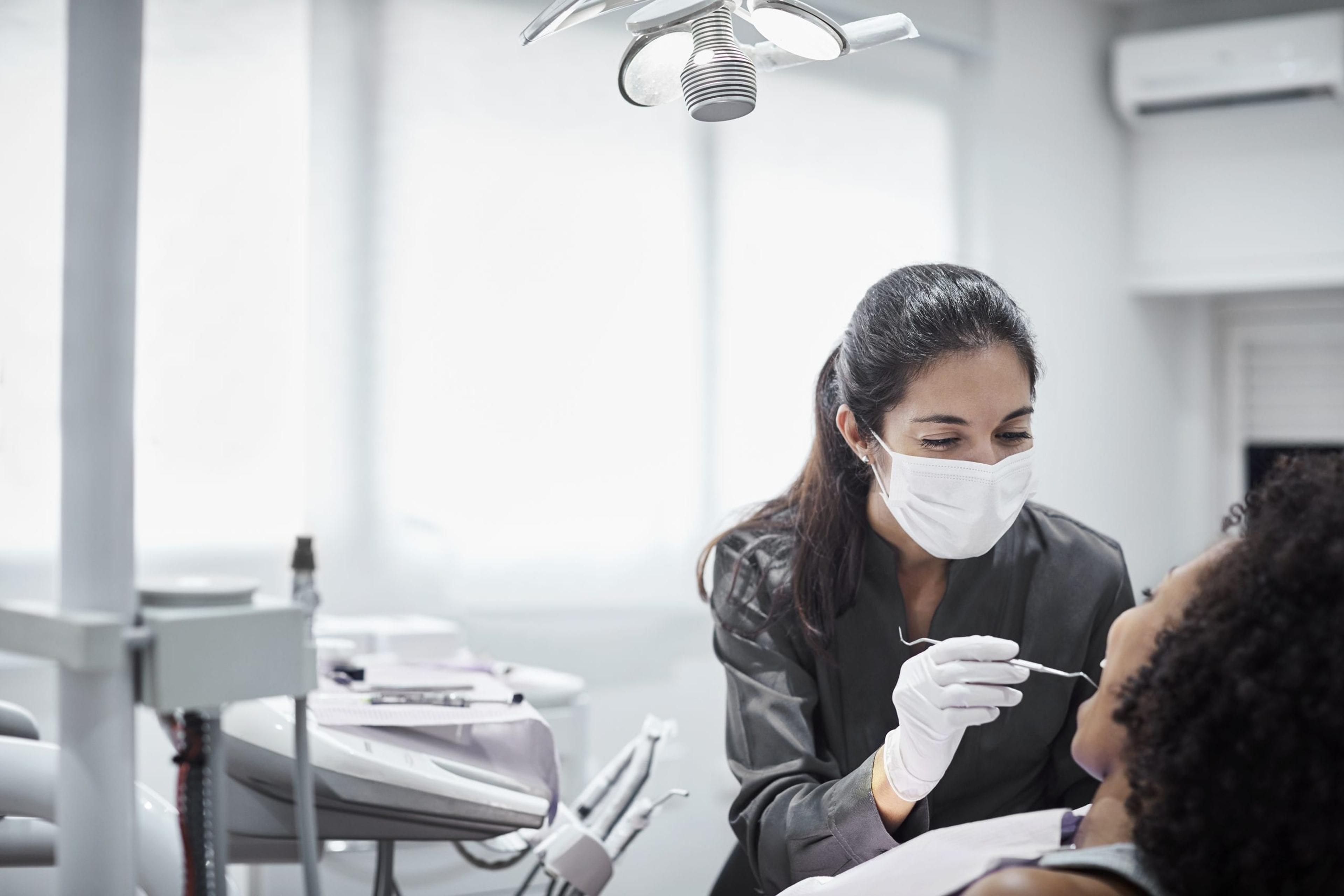 Dentist checking a patient