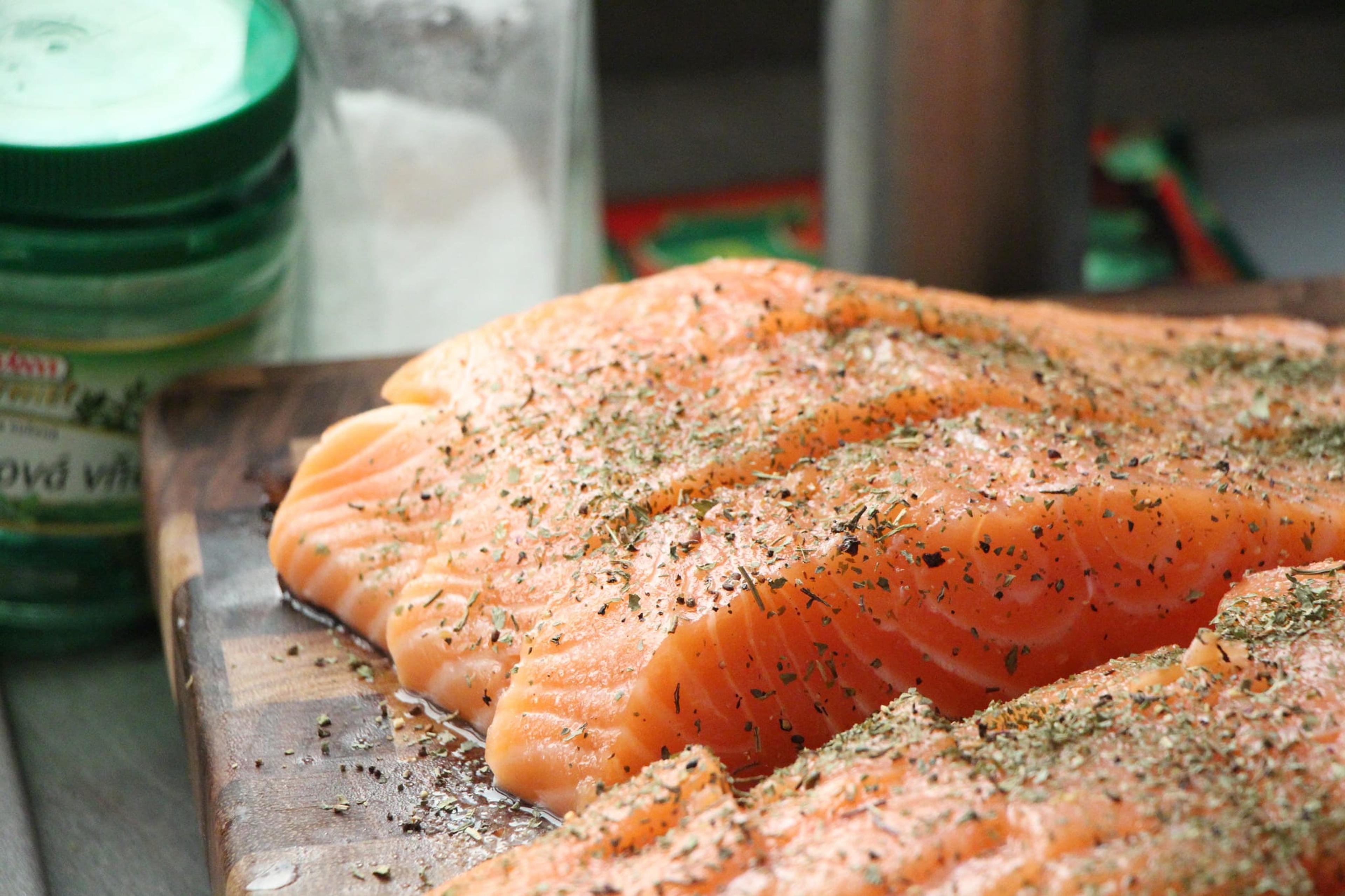 Filets of raw salmon with seasoning