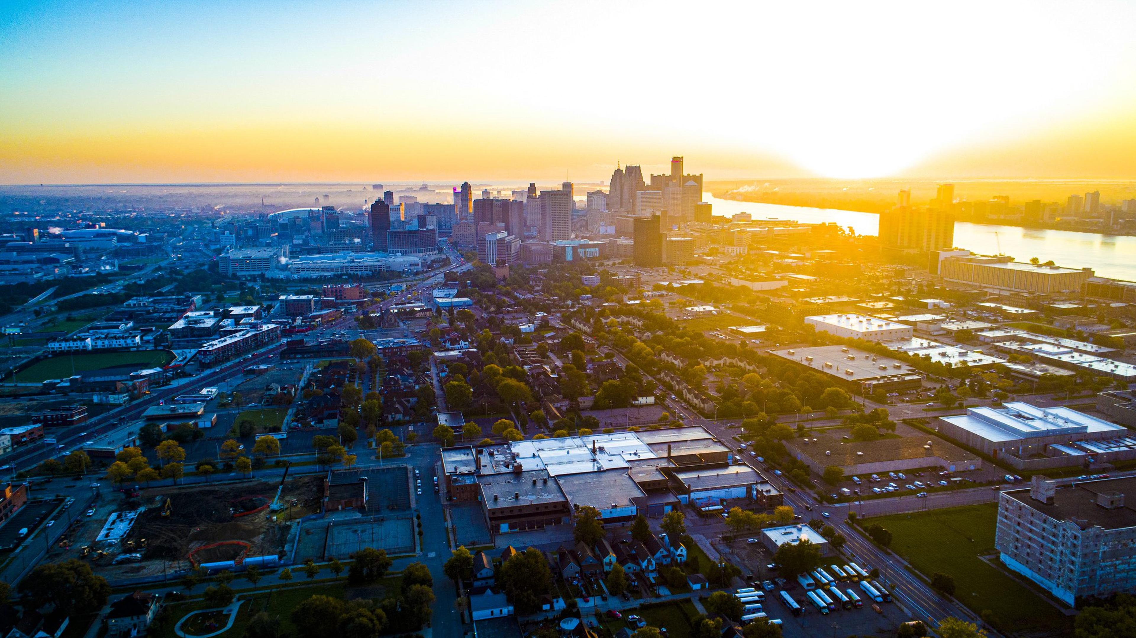 The Detroit skyline from a bird's eye view at sunrise.