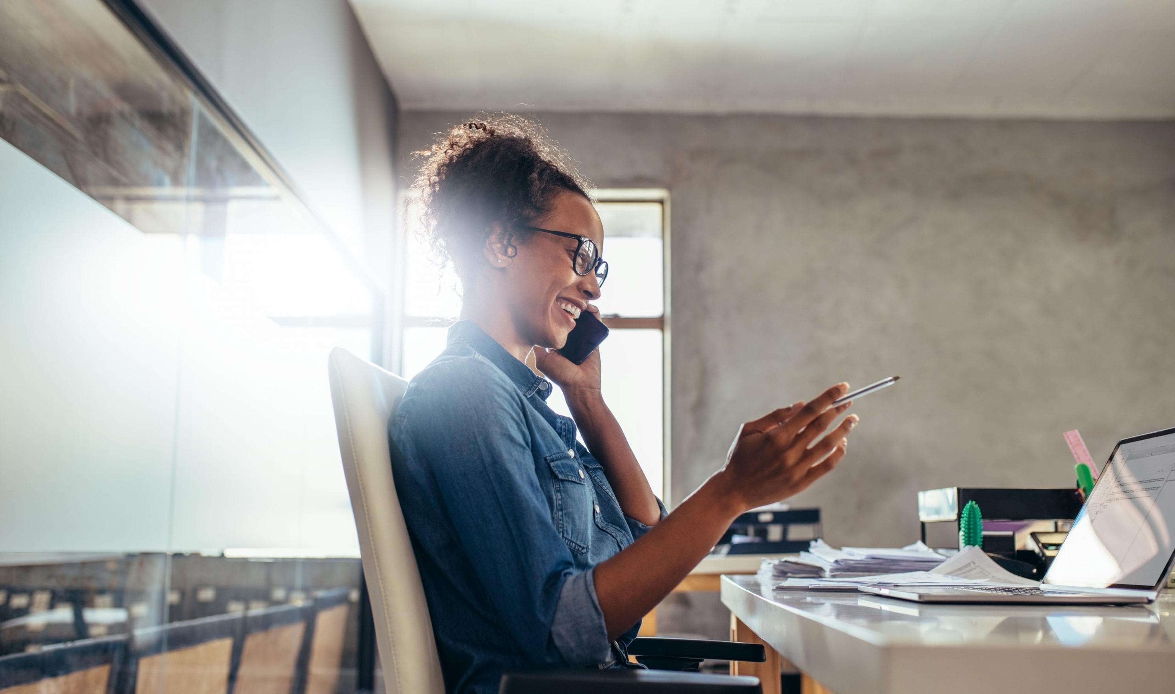 Business woman smiling on phone