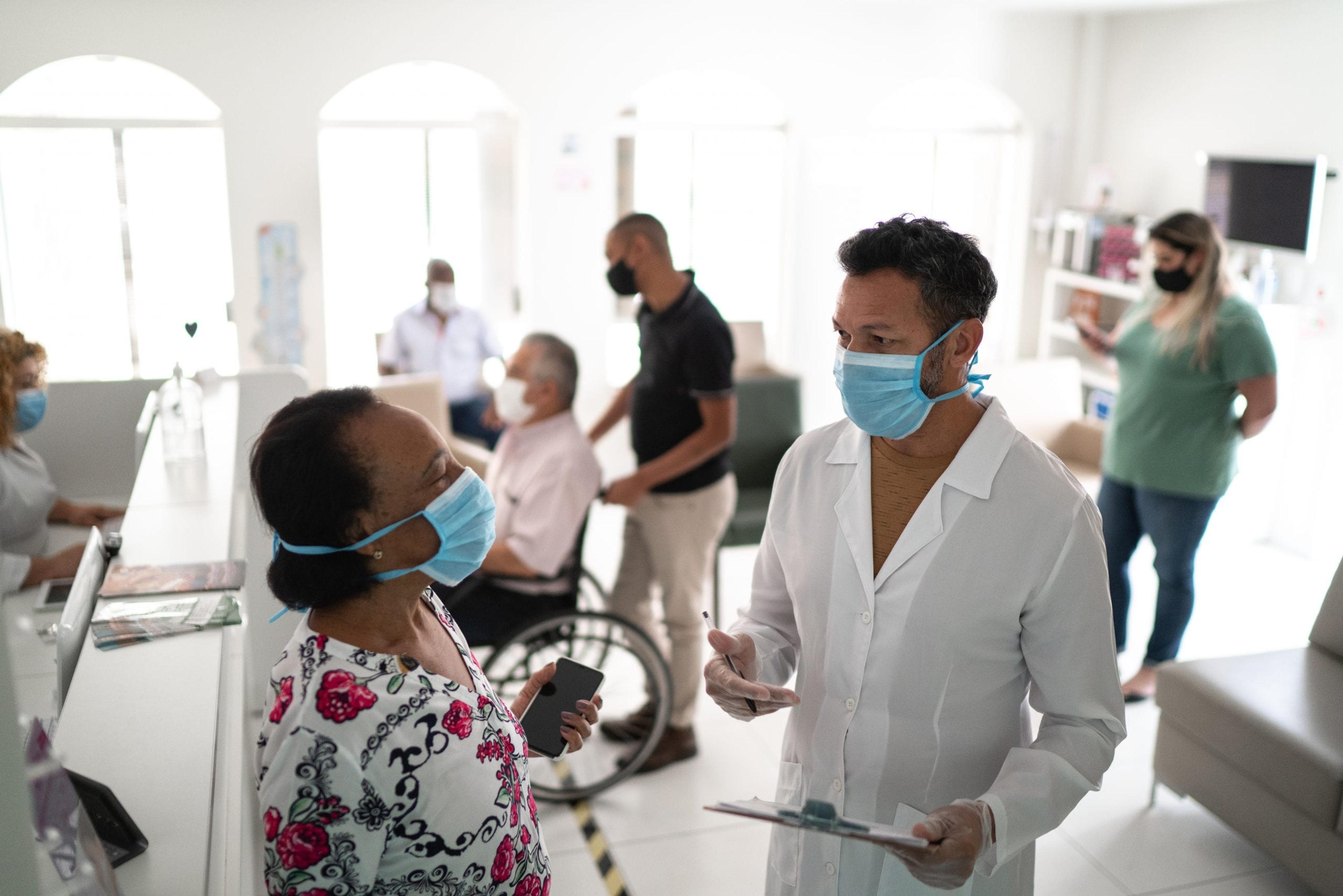 Woman talking to a doctor at a clinic